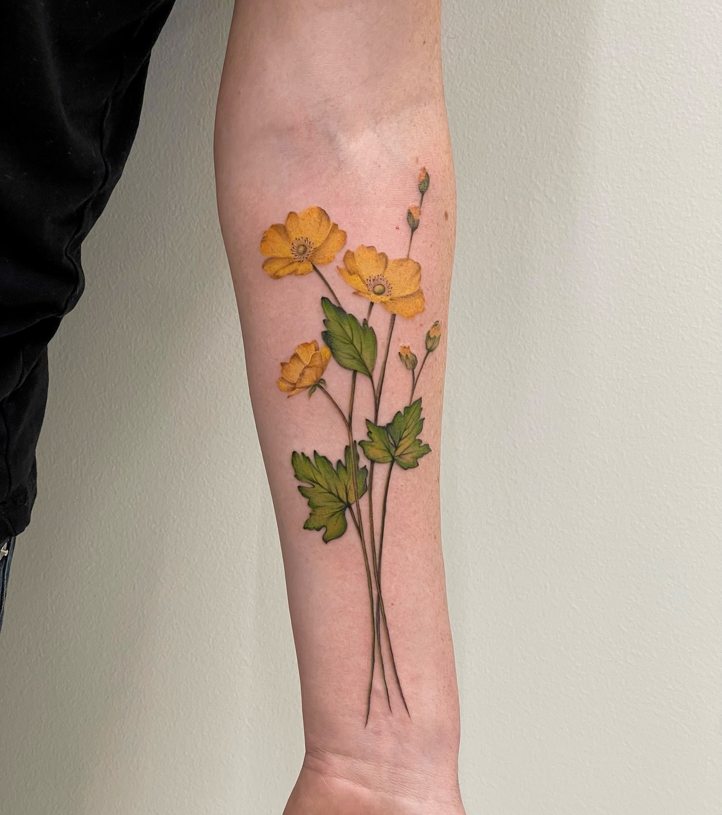 Yellow flowers realism tattoo on the forearm by Seattle Tattoo Artist PingPing, Seattle, Washington