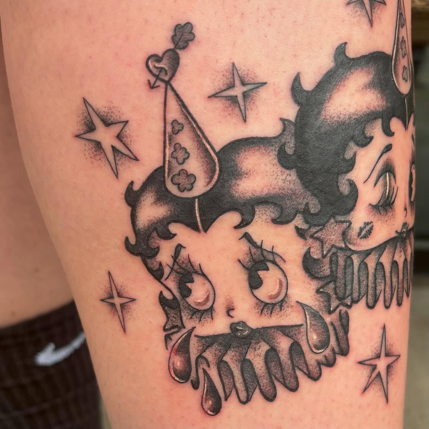 Clown dotwork tattoo on the thigh by Jordan Wray
