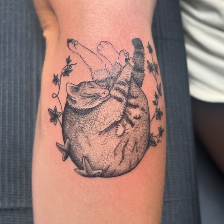 Cat dotwork tattoo on the forearm by Abbi