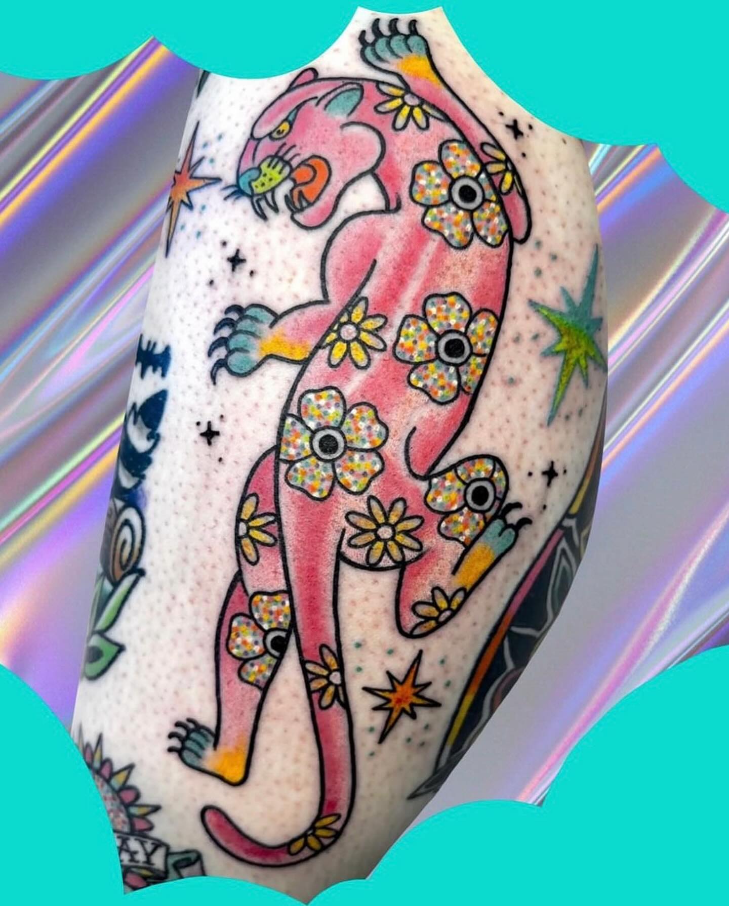 Panther with flowers American traditional tattoo on the forearm by Chelsea Lane