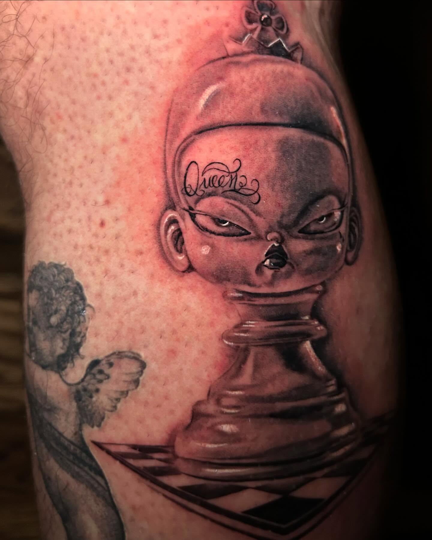 Chess piece realism tattoo on the thigh by Josy Castro