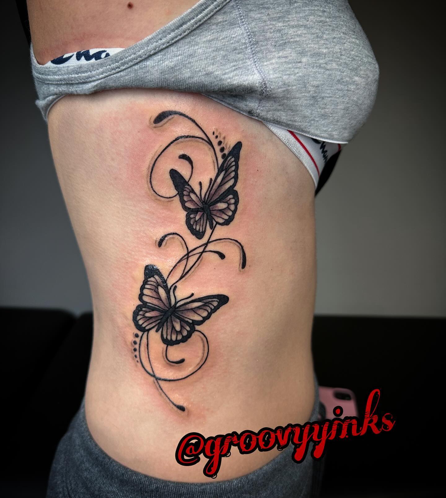 Butterflies black and grey tattoo on the ribs by groovyyinkss