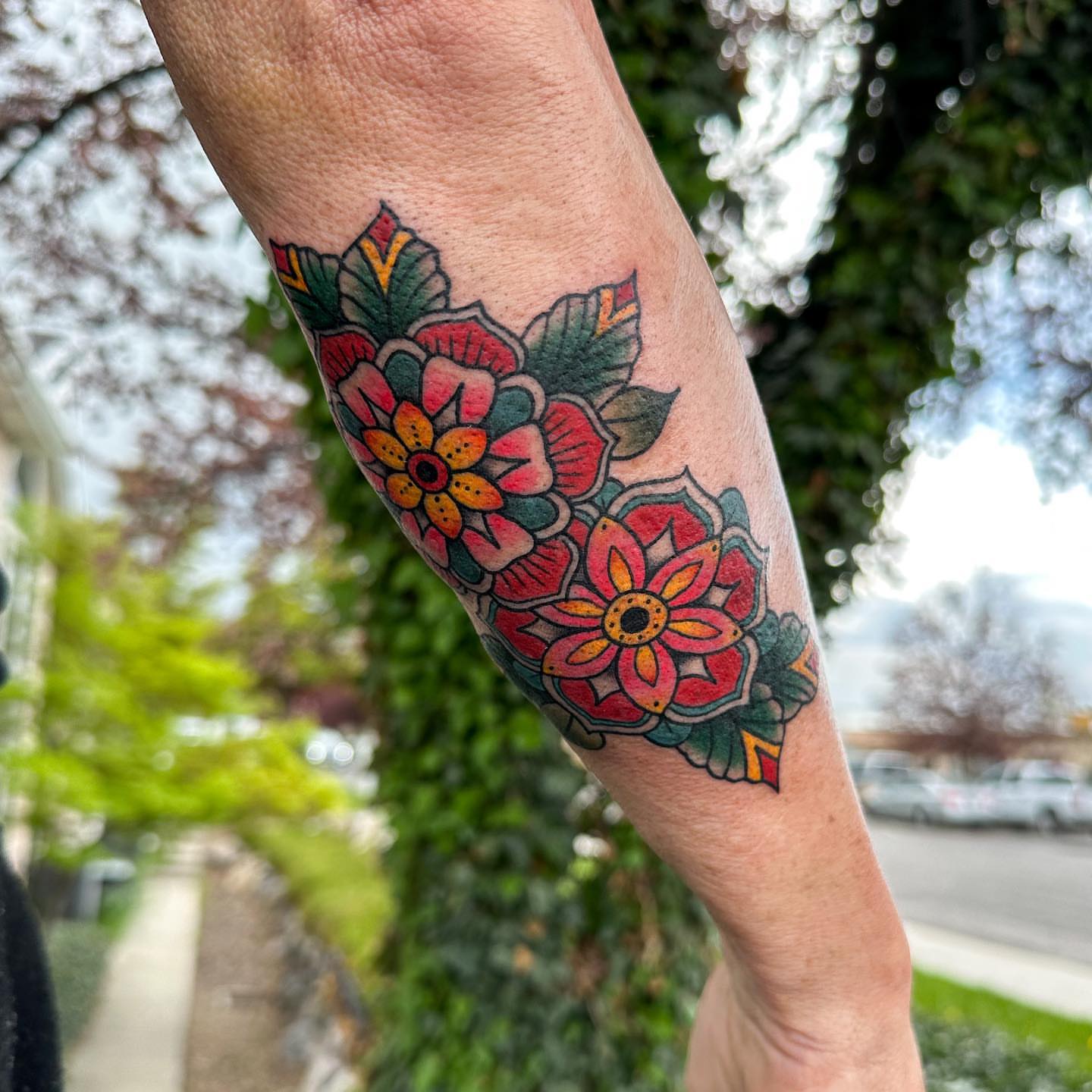 Floral bouquet American traditional tattoo on the forearm by Gabby Tolley🌛