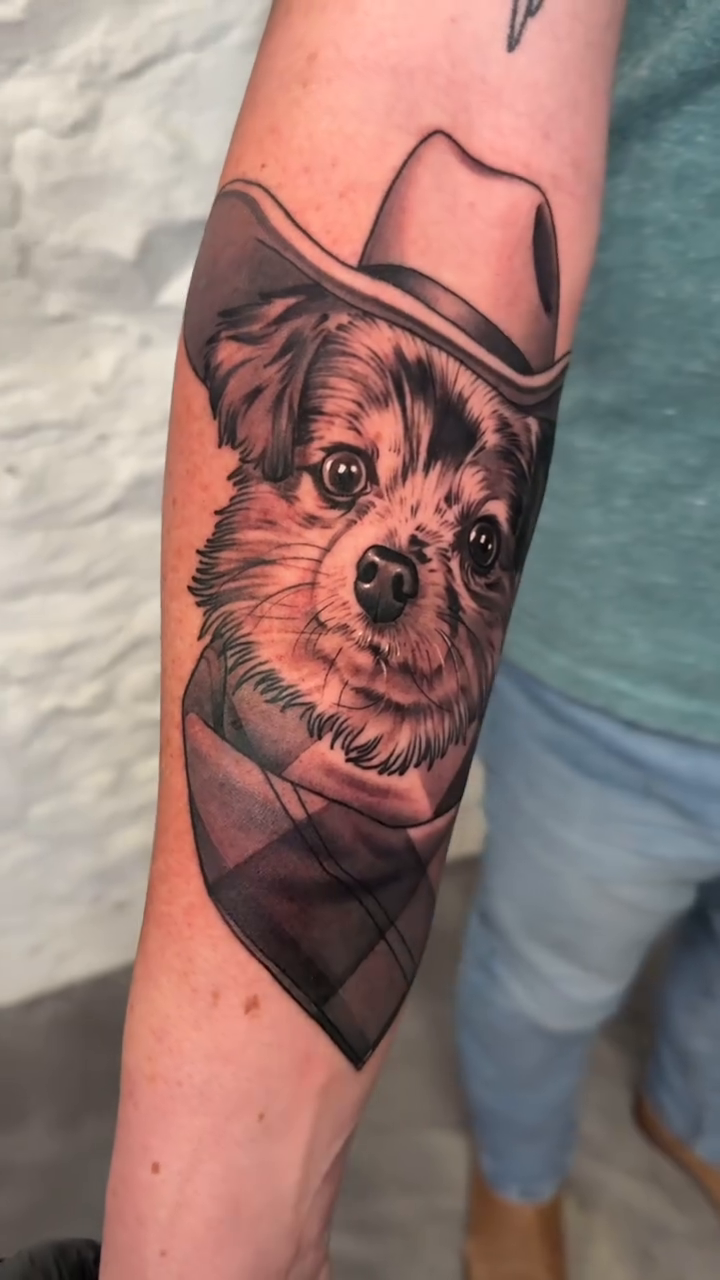Dog and cowboy hat realism tattoo by Bradley Dozier