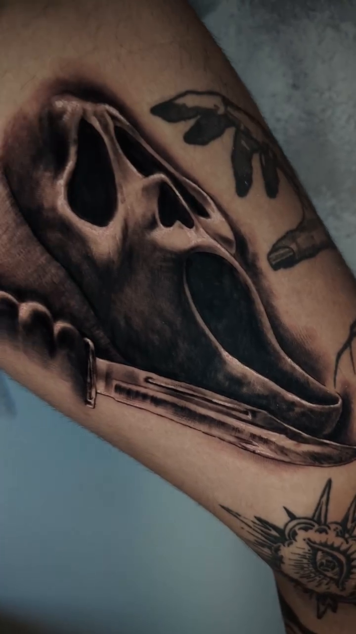 Scream mask and knife dark realism tattoo by Miami Florida Tattoo Artist