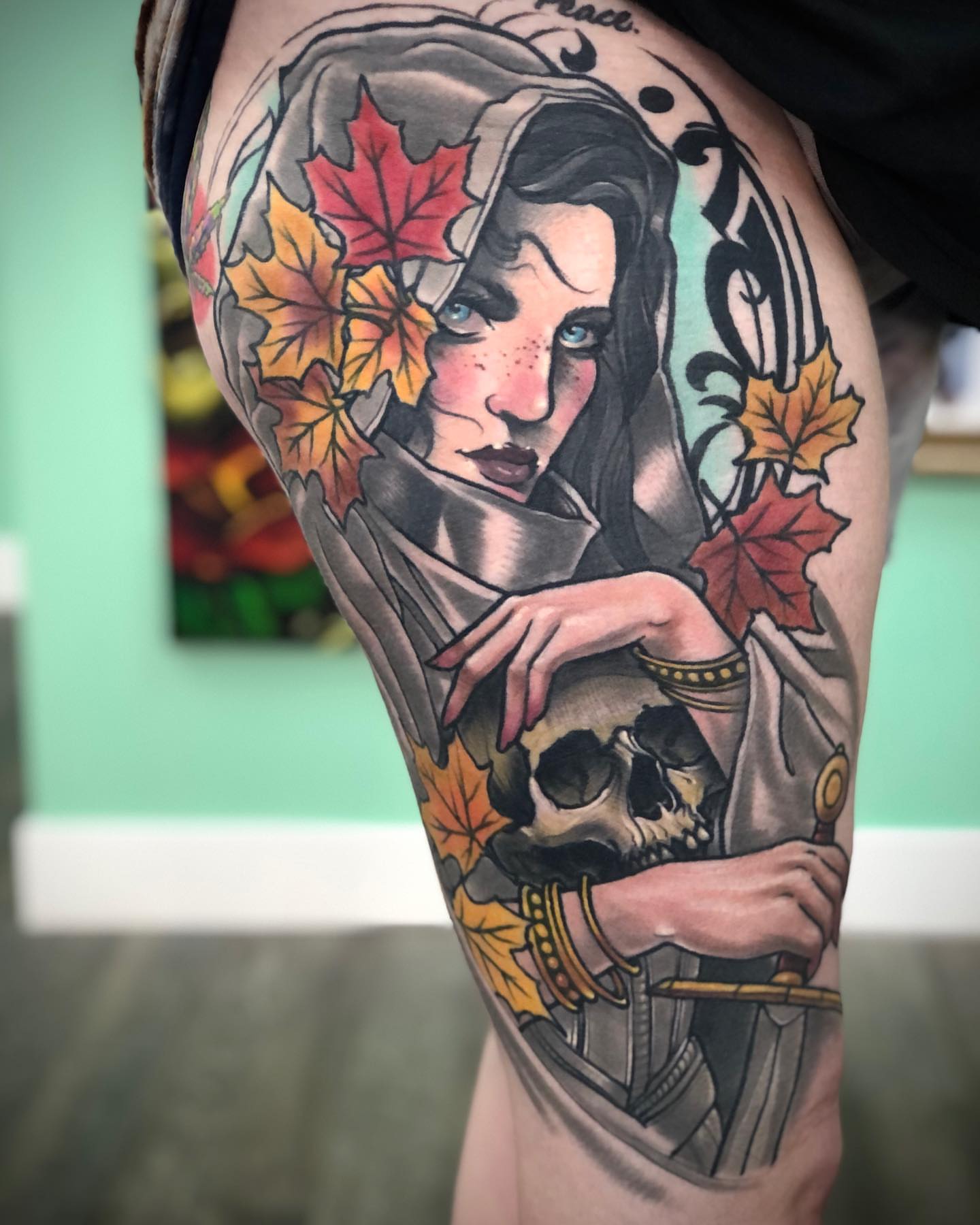 Woman with skull realism tattoo on the thigh by Alec Bauer