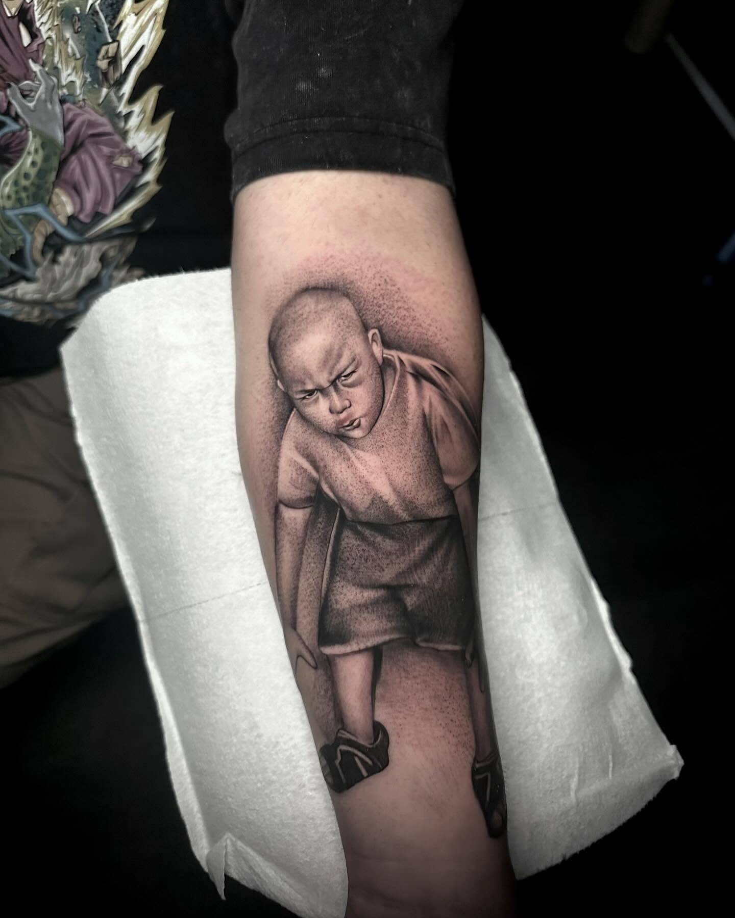 Bald monk realism tattoo on the forearm by Rawb