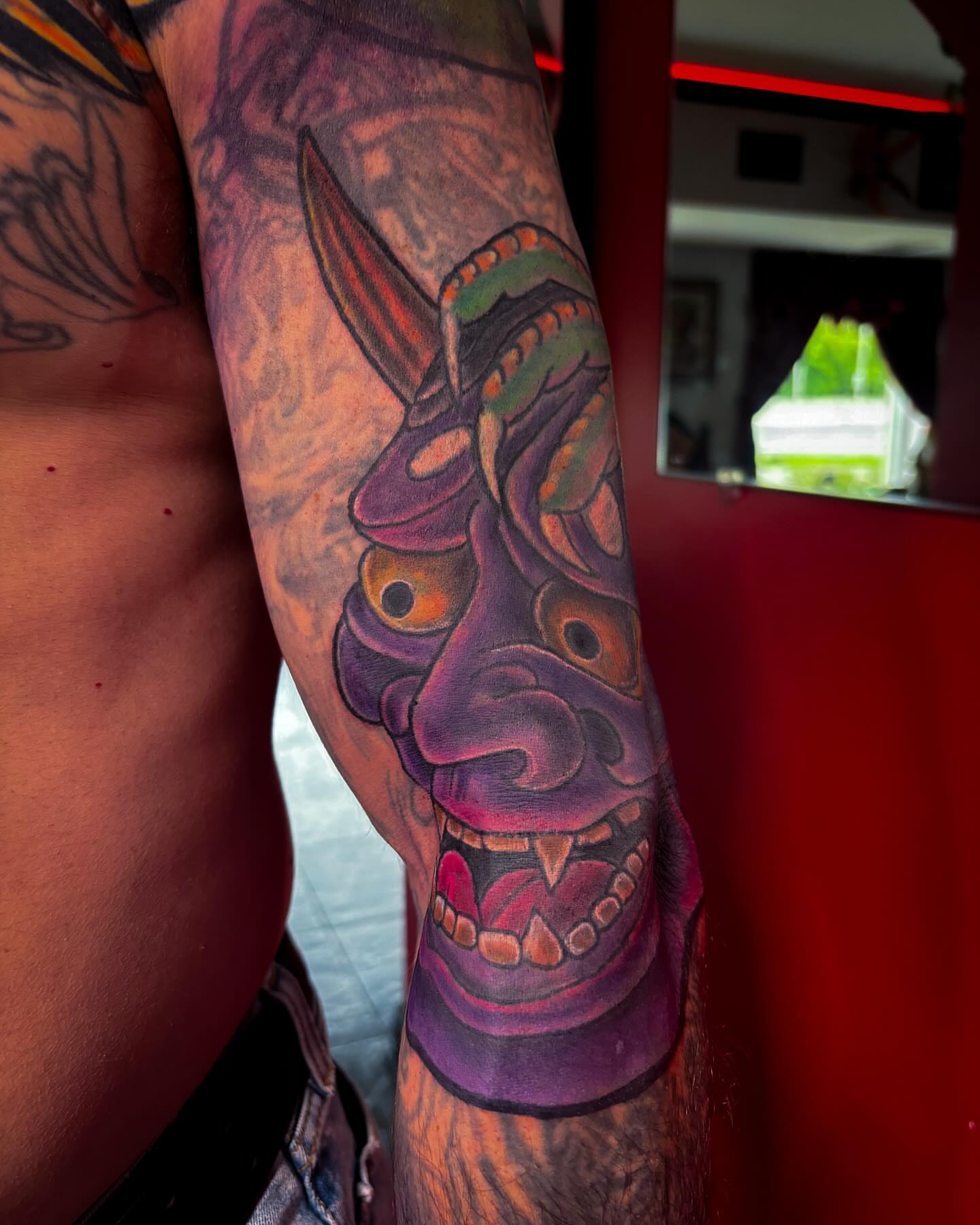 Mask japanese irezumi tattoo on the forearm by Bobby Glennon