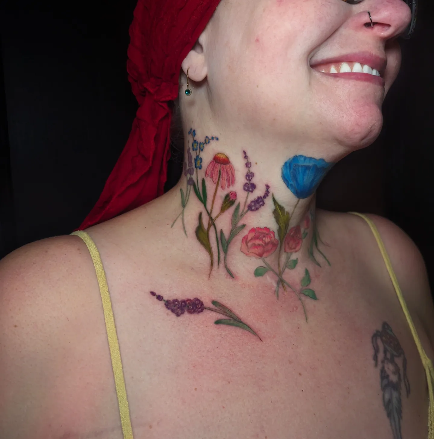 Floral arrangement watercolor tattoo on the neck by Cat