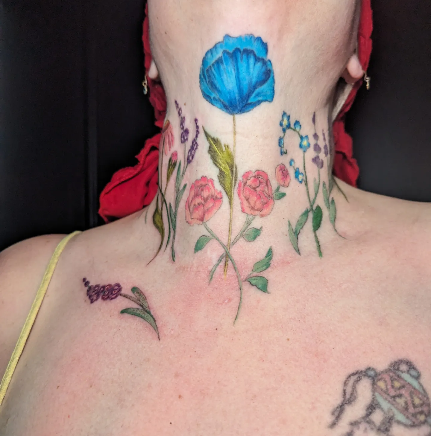 Floral arrangement watercolor tattoo on the neck by Cat