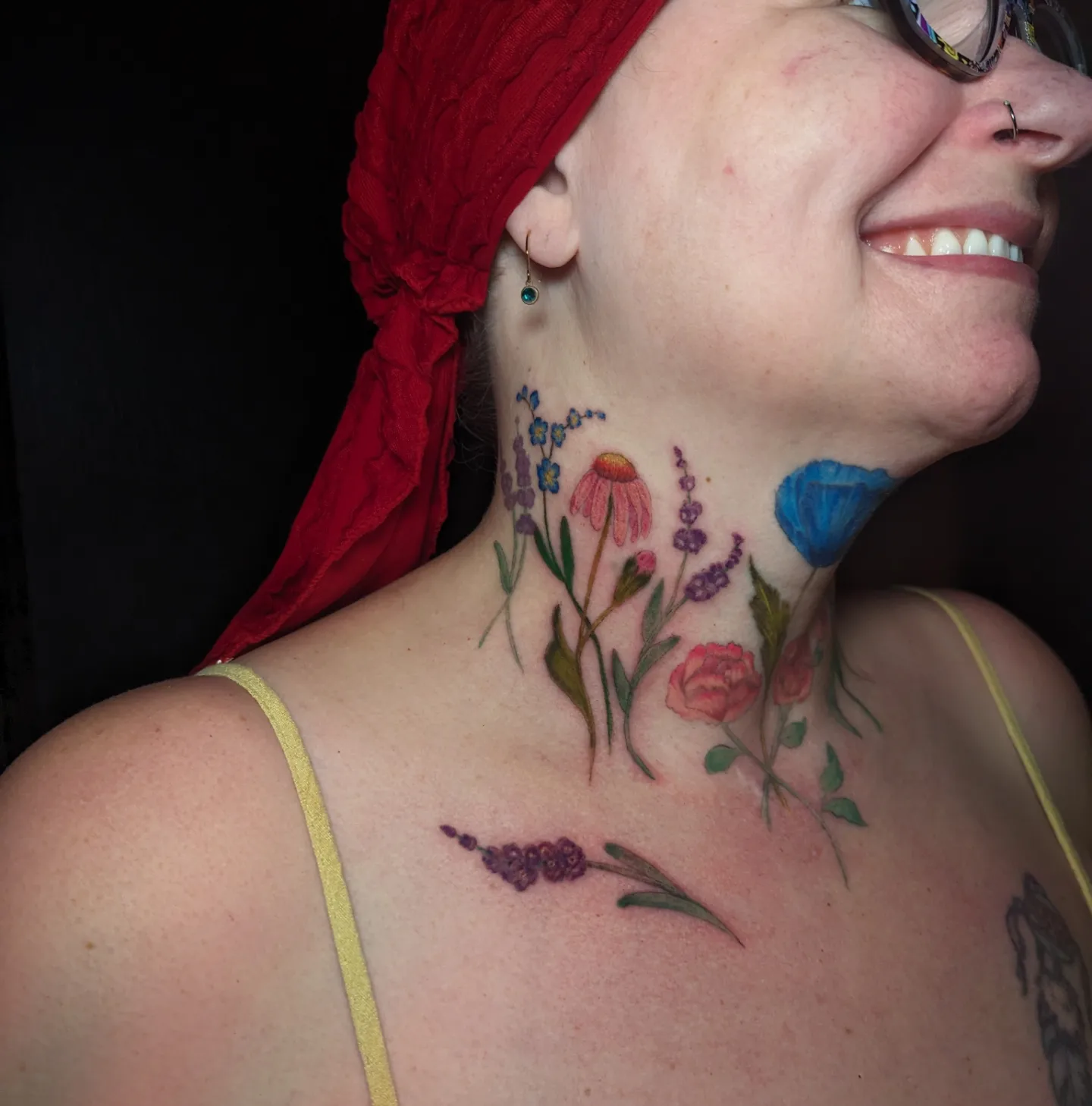 Floral arrangement watercolor tattoo on the neck by Cat