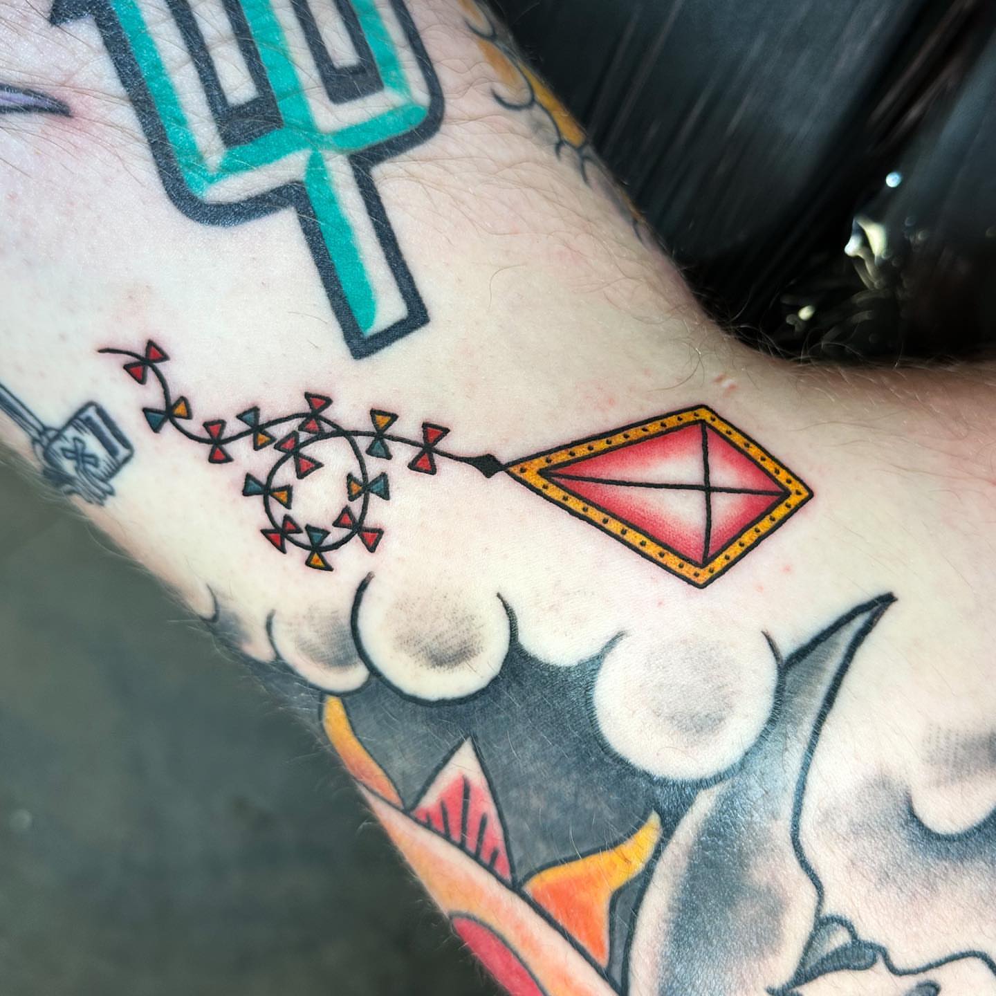 Geometric kite geometric tattoo on the forearm by Gabby Tolley🌛