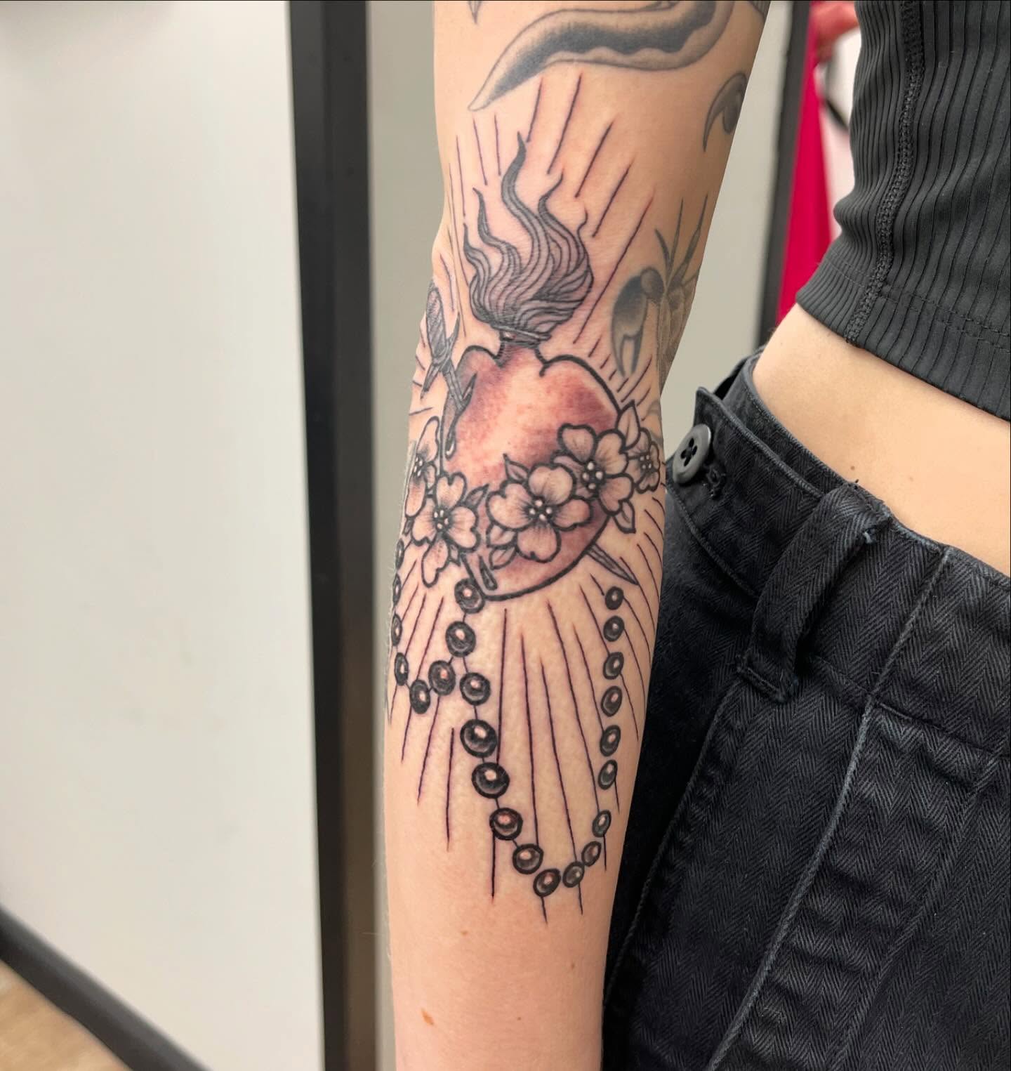 Heart with flowers dotwork tattoo on the forearm by Alejandro Juarez