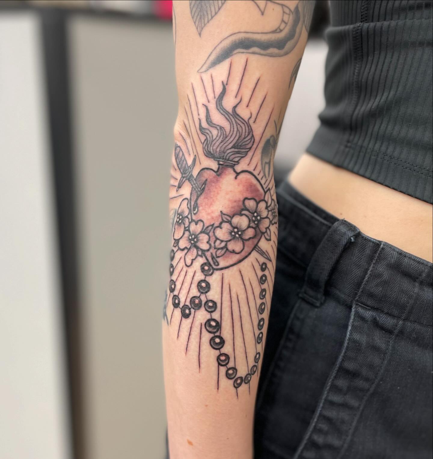 Heart with flowers dotwork tattoo on the forearm by Alejandro Juarez