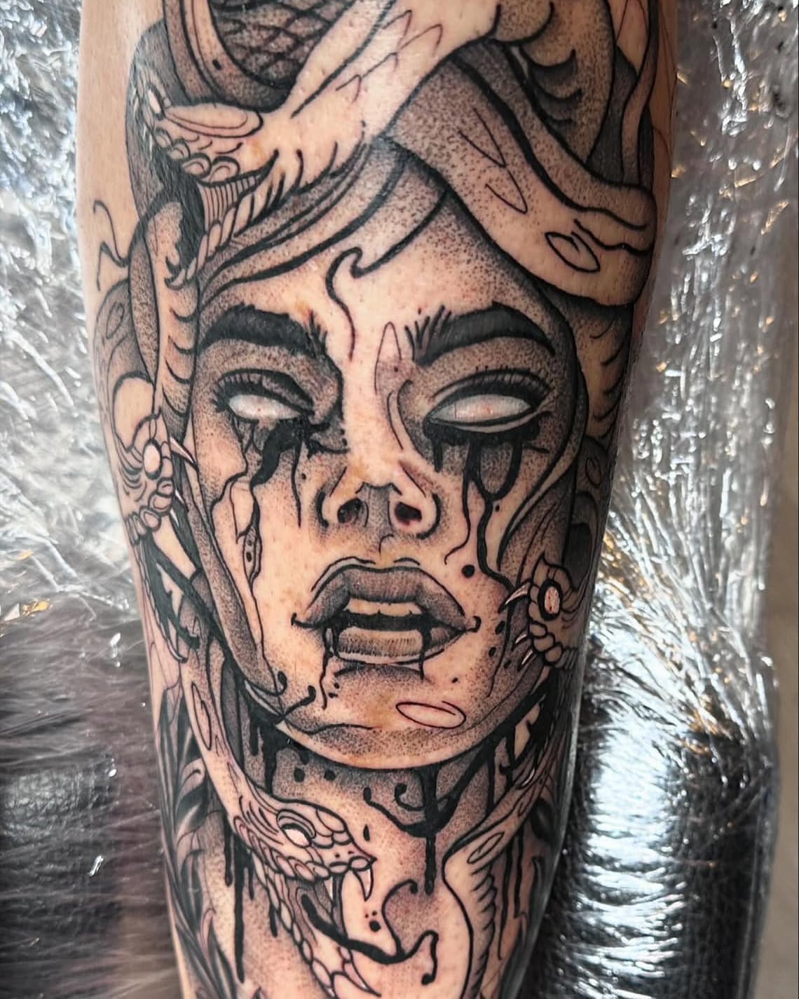 Woman's face with snakes dotwork tattoo on the forearm by Chris_Tatt2_D’Ascenzo