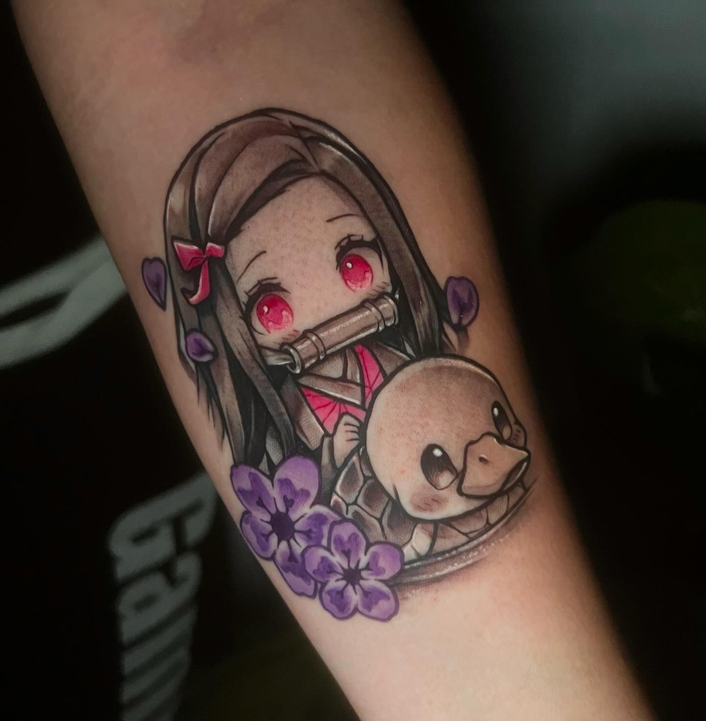 Anime girl with otter anime tattoo on the forearm by emi