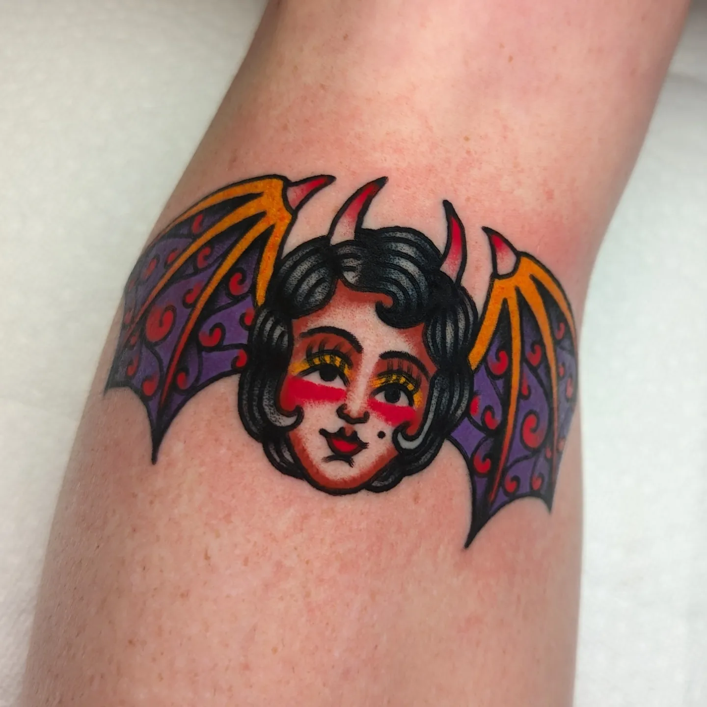 Bat girl American traditional tattoo on the forearm by Zack Mueller