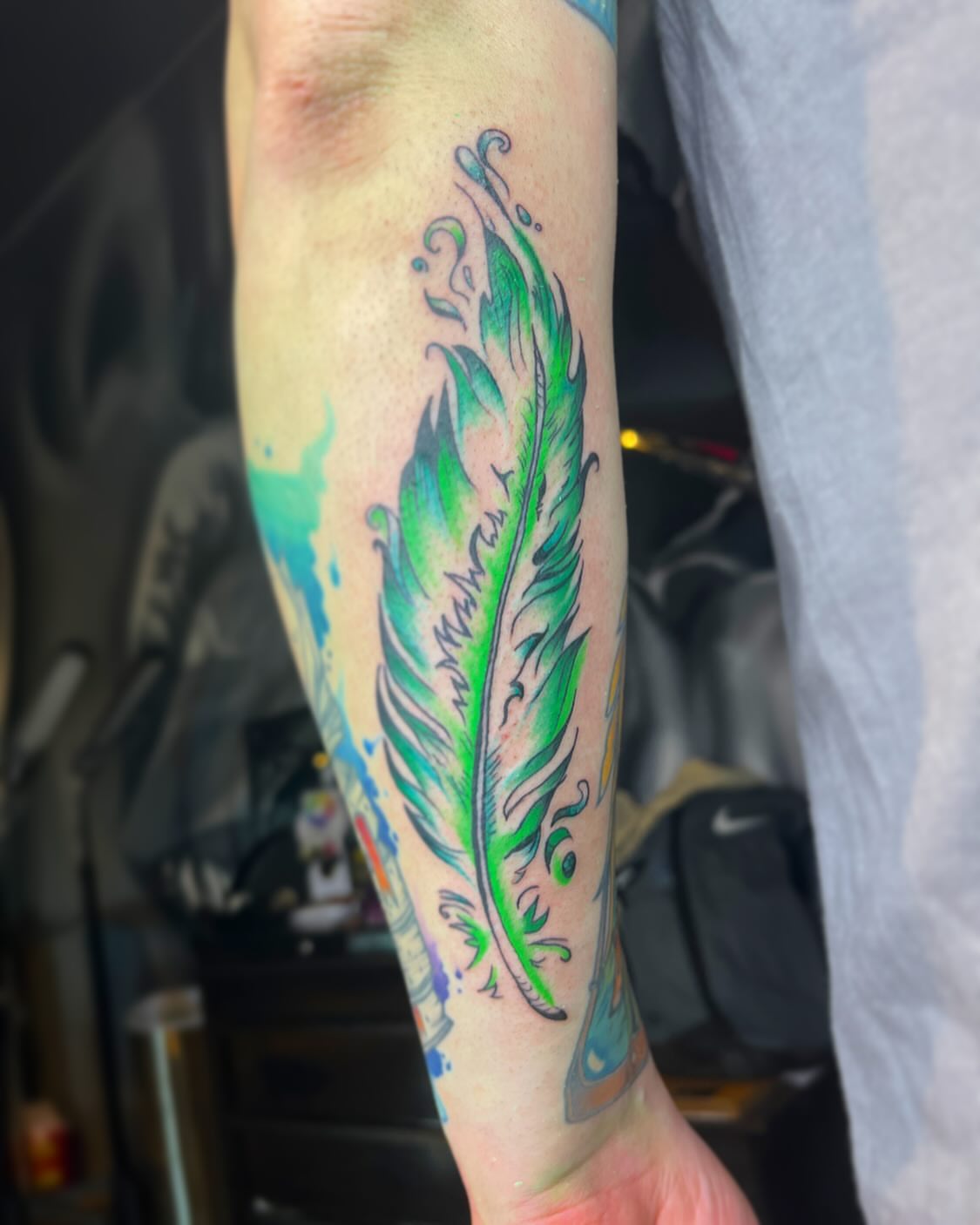 Feather watercolor tattoo on the forearm by ✩ 🕯️☾༺♰ gracey ༻☽🕯️✩