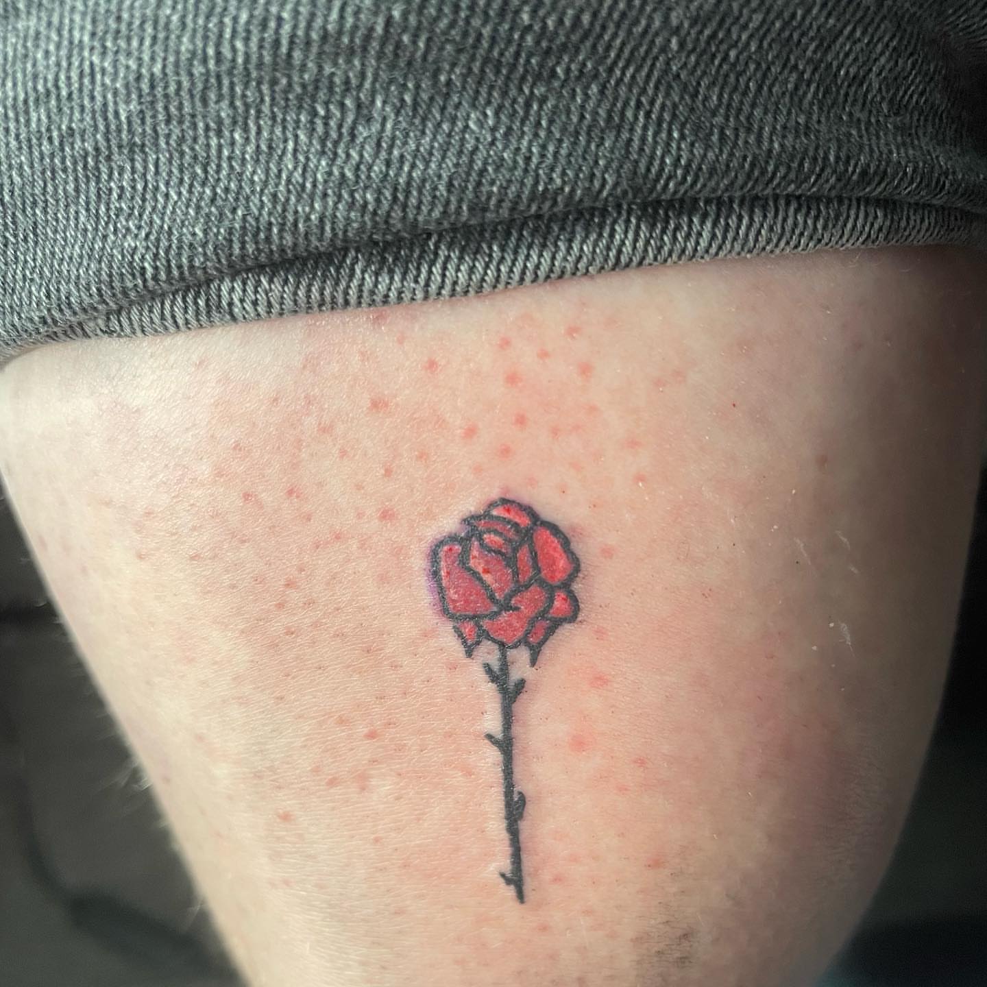 Rose black and grey tattoo on the thigh by ART
