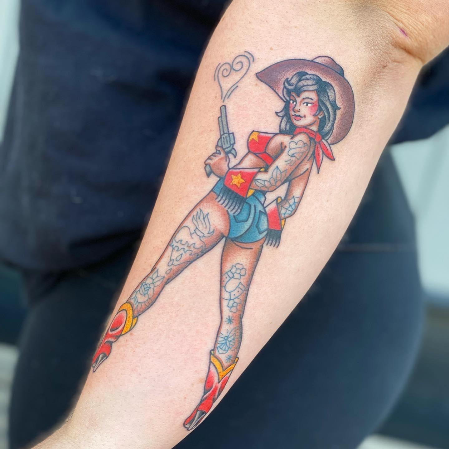 Cowgirl pin-up American traditional tattoo on the forearm by Chelstine, Encinitas, California