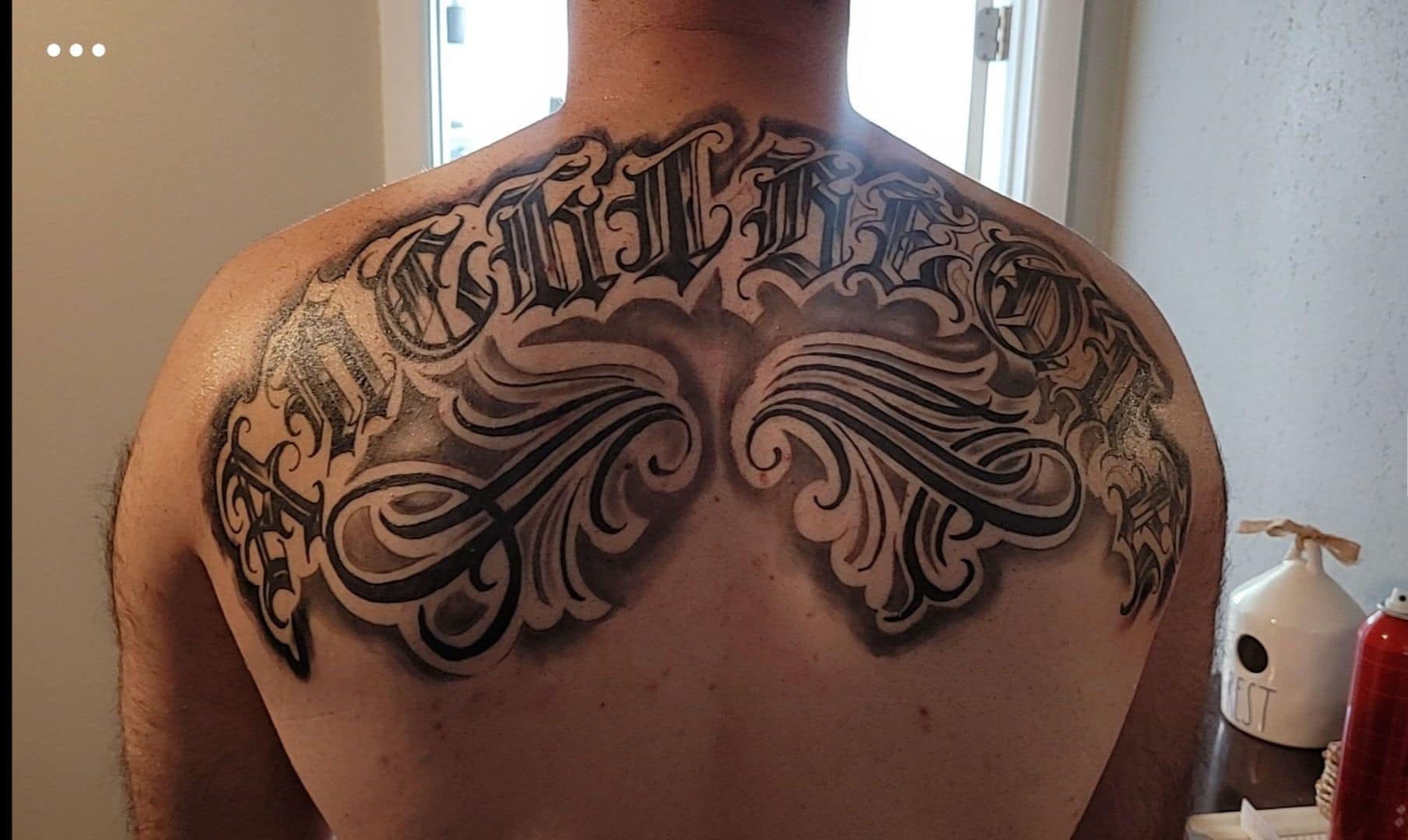 Script lettering lettering script tattoo on the back by Bryant Ramirez