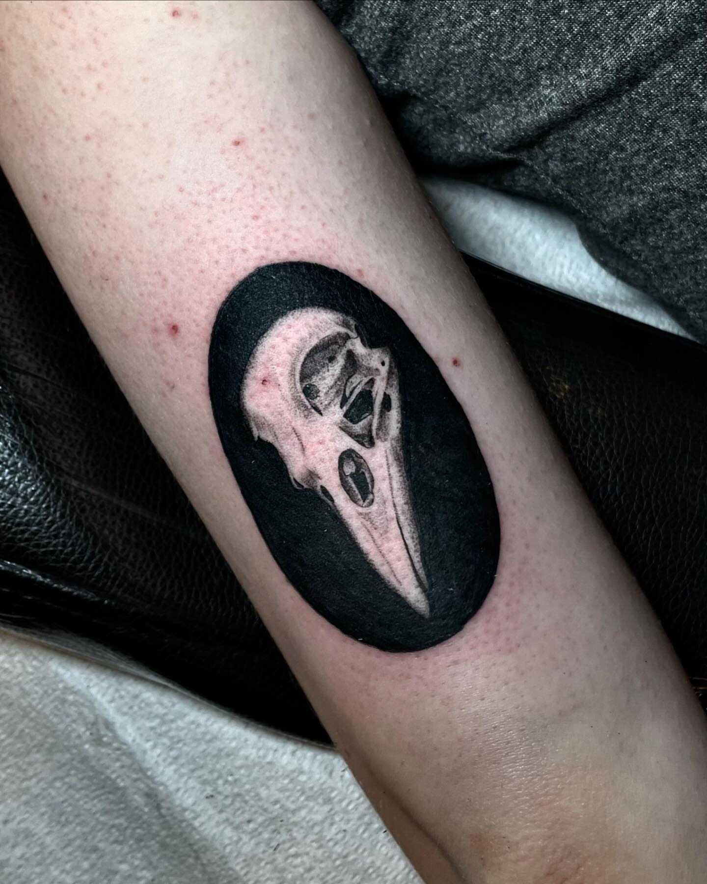Skull black and grey tattoo on the forearm by Tattoo Artist