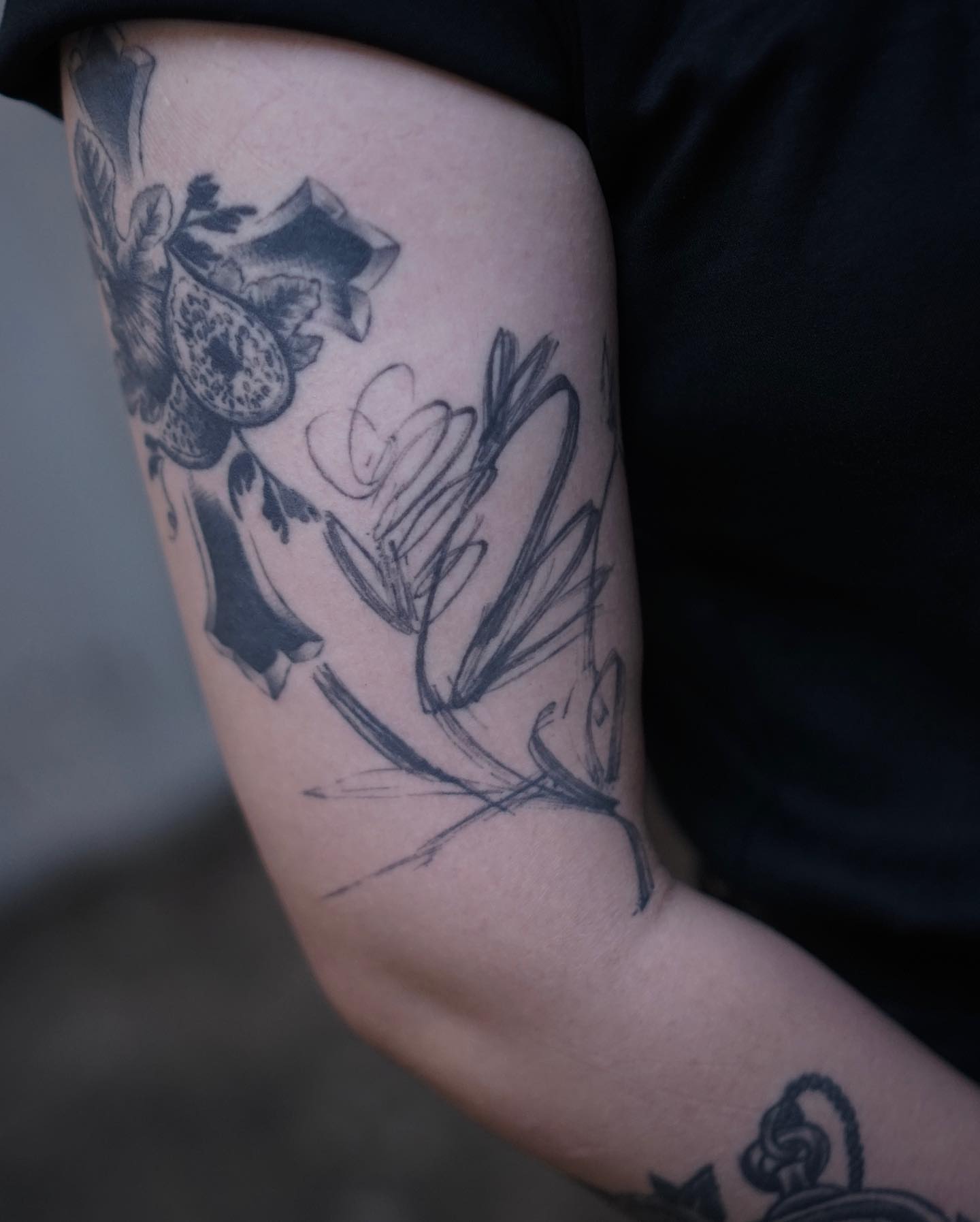 Floral arrangement black and grey tattoo on the forearm by Young one 영원