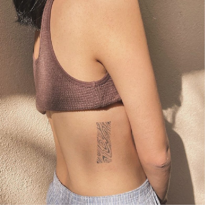 Abstract pattern black and grey tattoo on the torso by Gaya