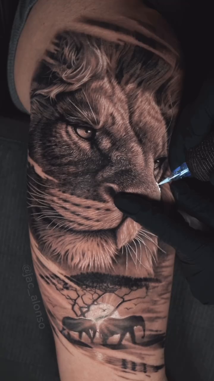 Lion and savanna landscape realism tattoo by Jesus Alonso