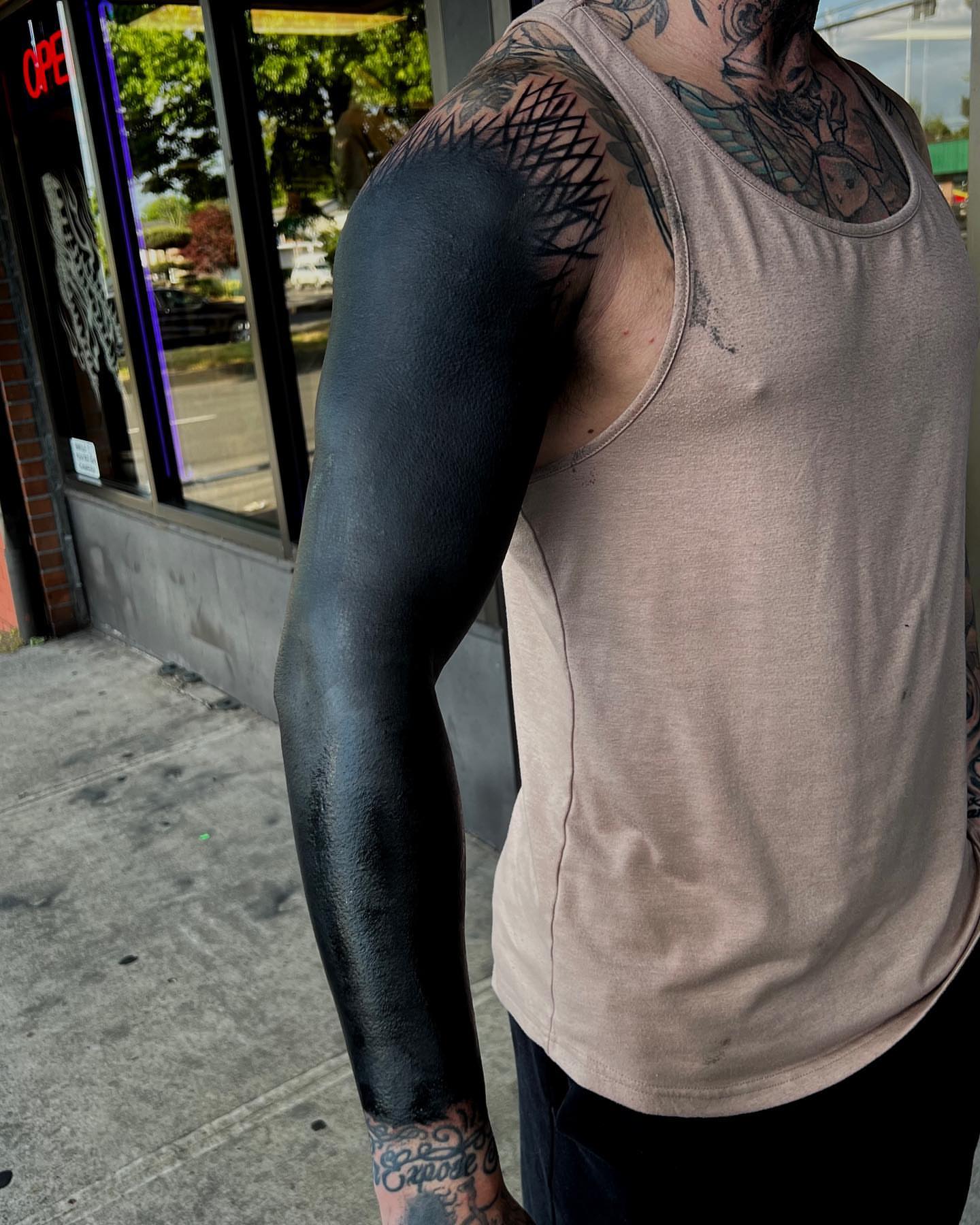 Full sleeve black and grey tattoo on the upper arm by Jon Crook, Portland, Oregon