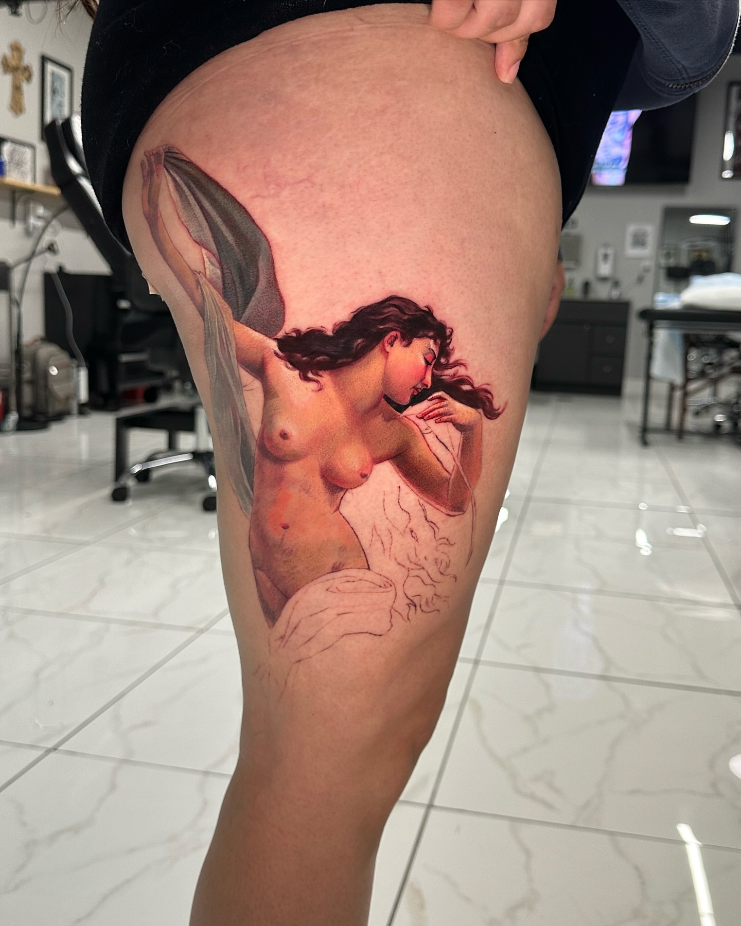 Nude woman realism tattoo on the thigh by Joey Hella Tattoo Artist