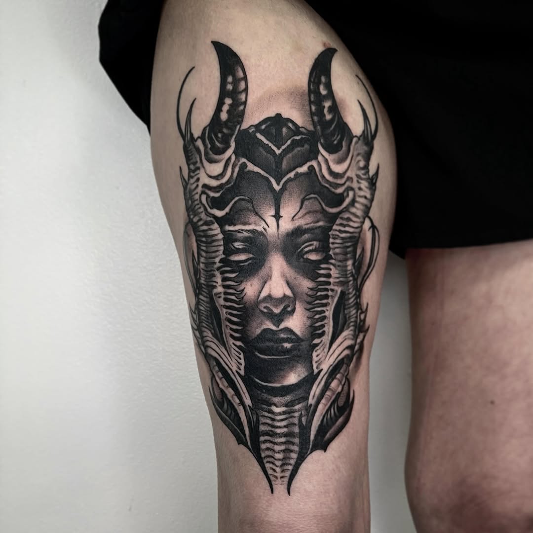 Demonic face with horns realism tattoo on the thigh by Briana Walker