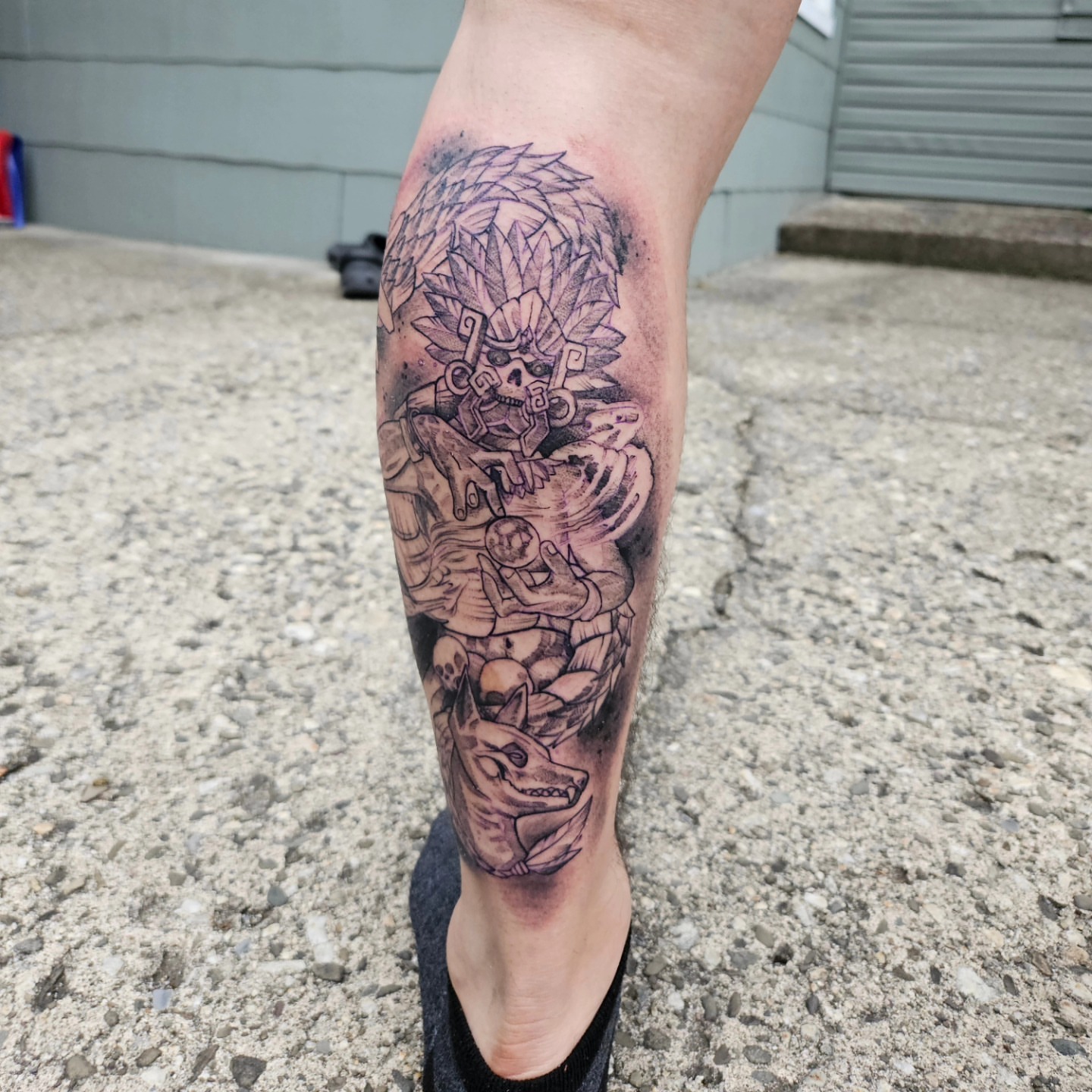 Mexican warrior black and grey tattoo on the calf by German Romero-Rendon