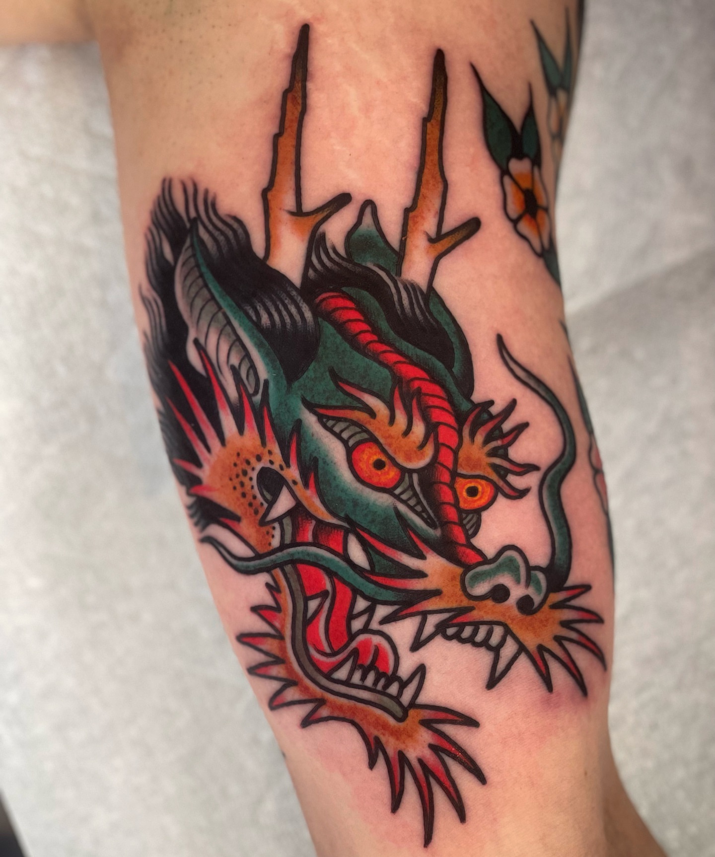 Dragon American traditional tattoo on the forearm by Jeff Miller philly traditional tattoo