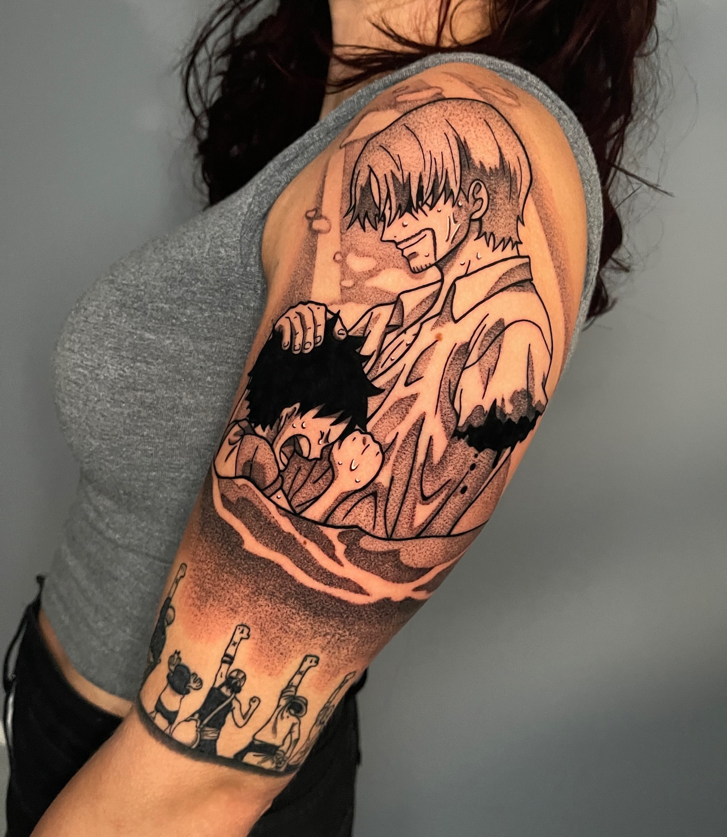 Anime characters dotwork tattoo on the upper arm by Anastasia Vives