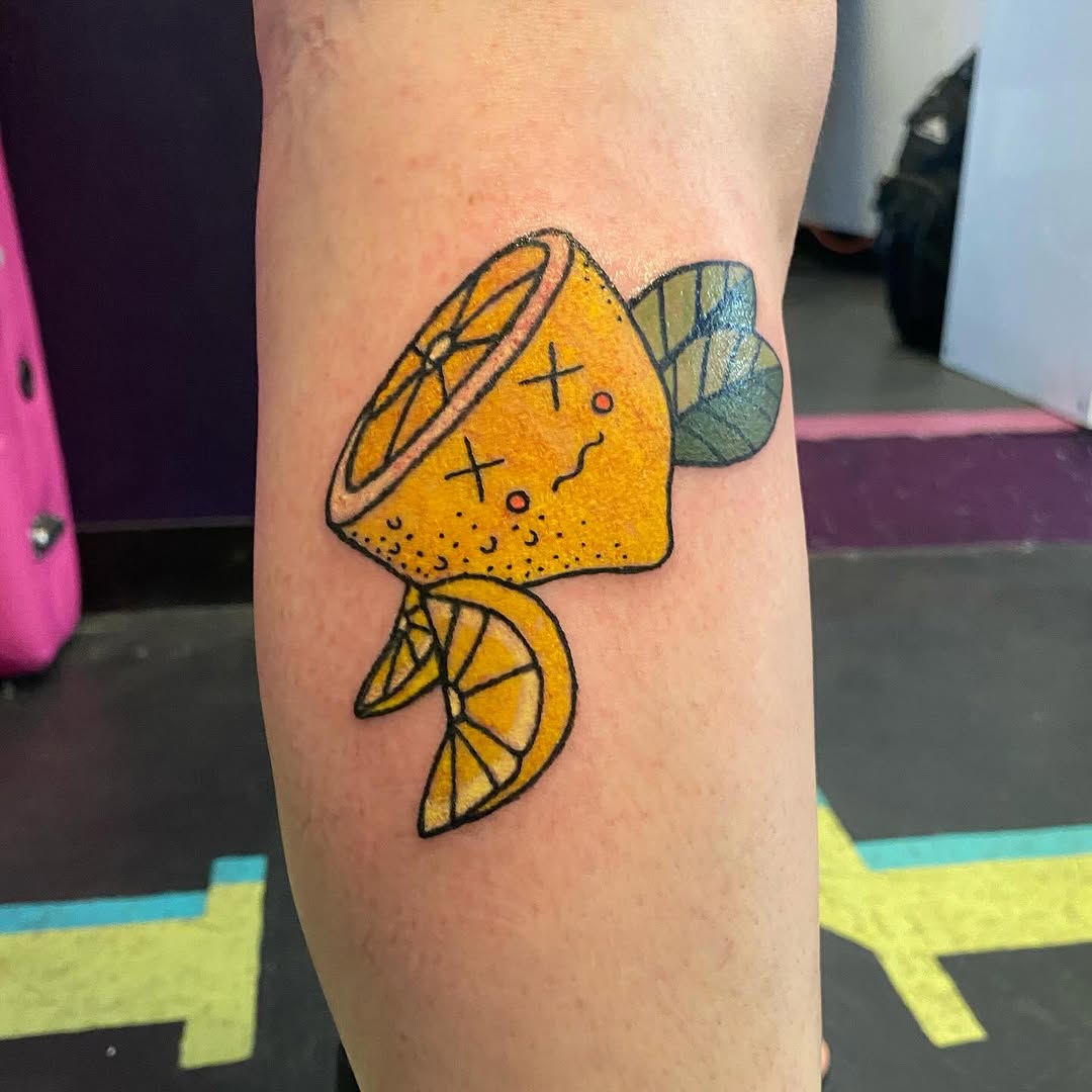 Cartoon lemon new school tattoo on the forearm by Tesla Kohl