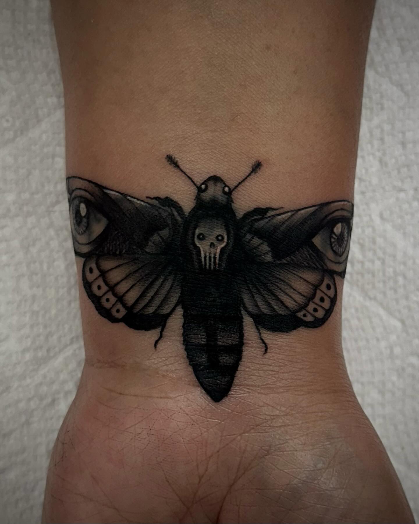 Butterfly dark realism tattoo on the forearm by Emily‹𝟹