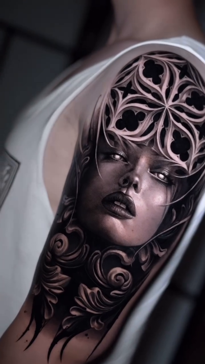 Woman with ornate headpiece realism tattoo by Sara Nieto.