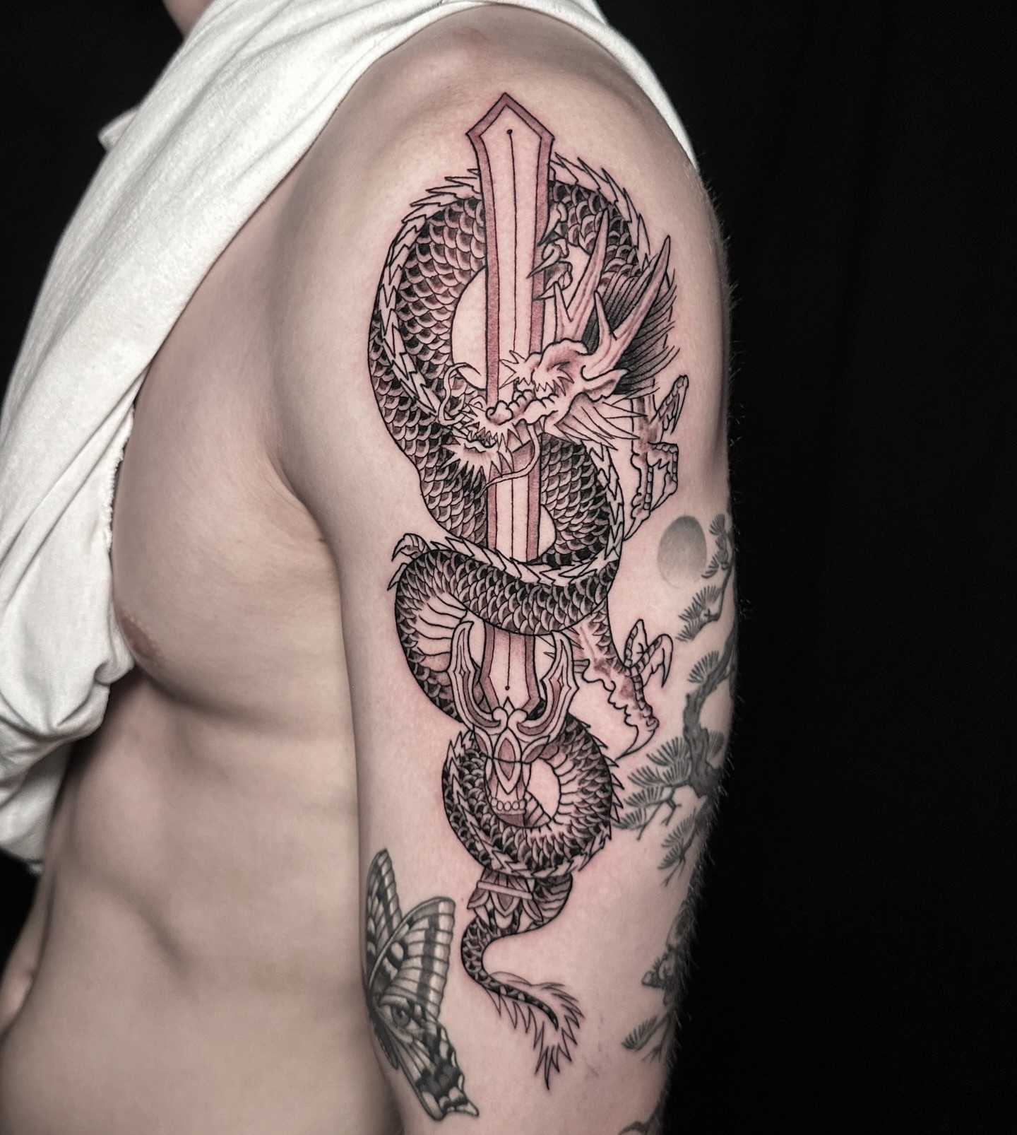 Dragon and sword japanese irezumi tattoo on the shoulder by Matt Trimble, Charlotte, North Carolina