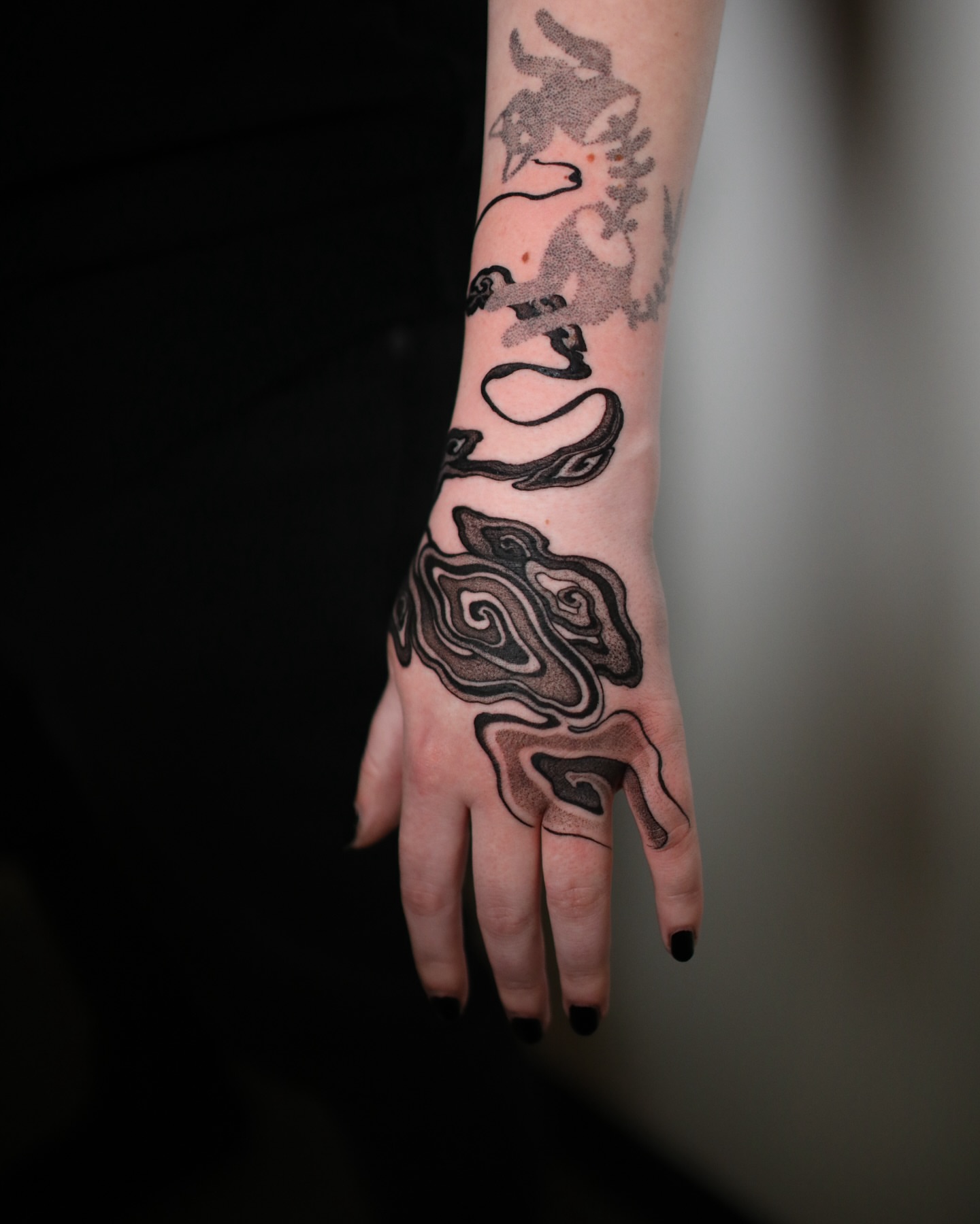 Abstract swirls dotwork tattoo on the hand by Strokin Konstantin