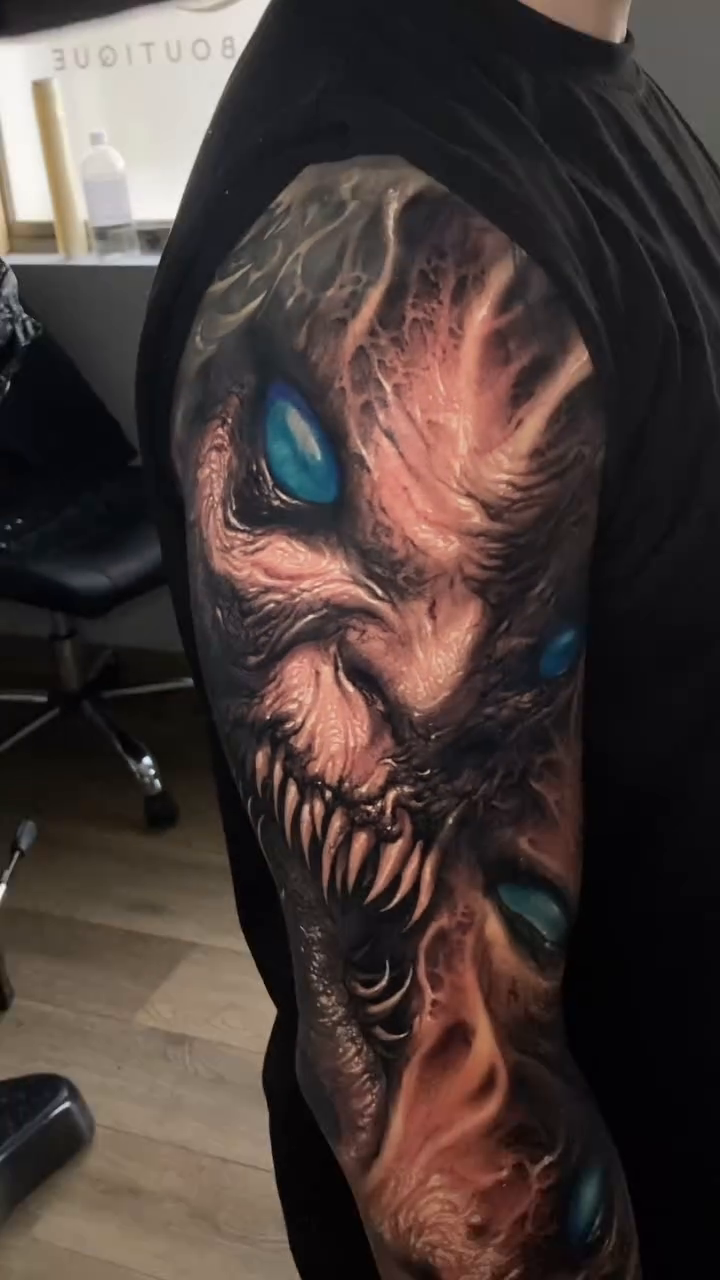 Demonic creature face realism tattoo by David Jorquera
