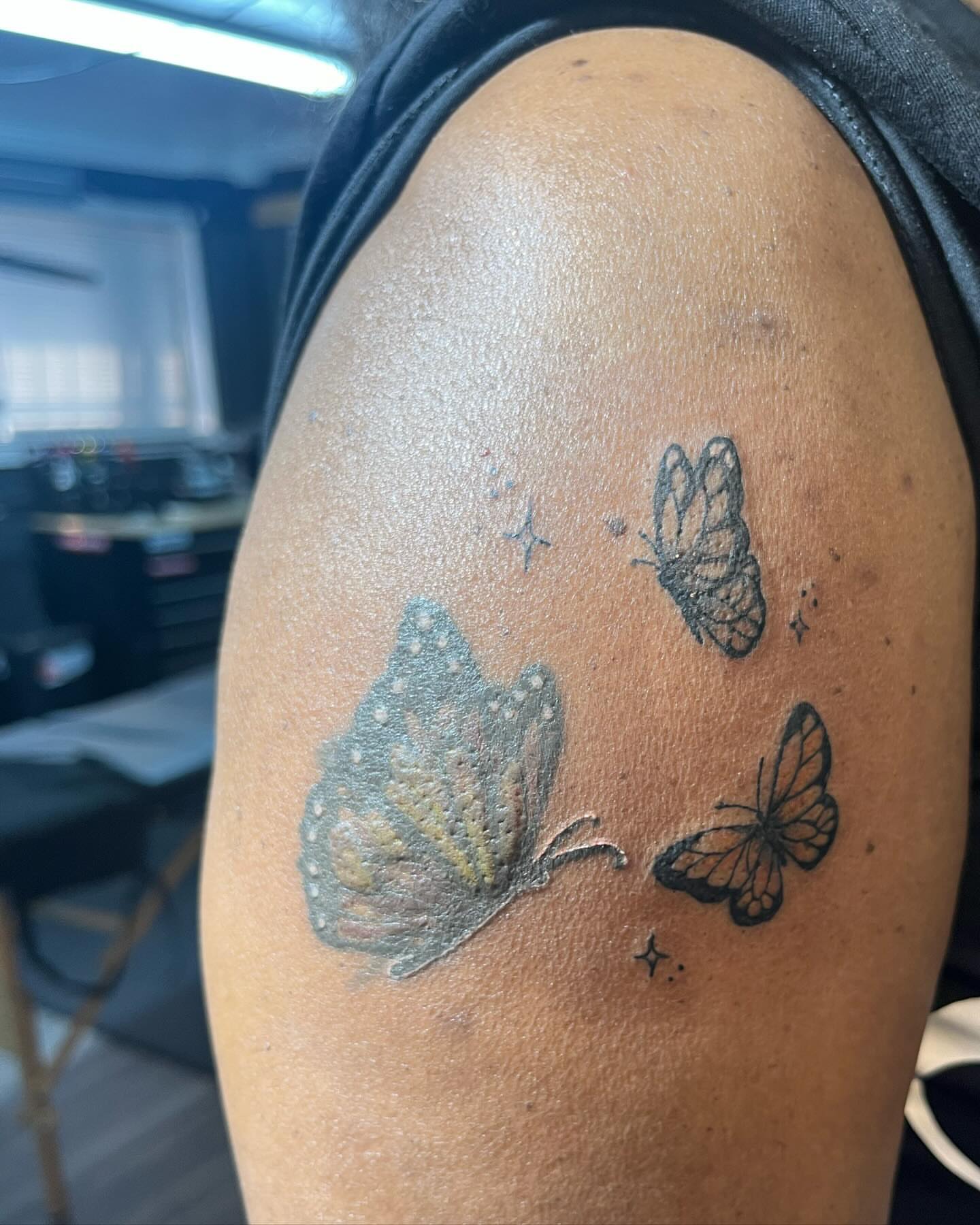 Butterflies black and grey tattoo on the shoulder by Alesia