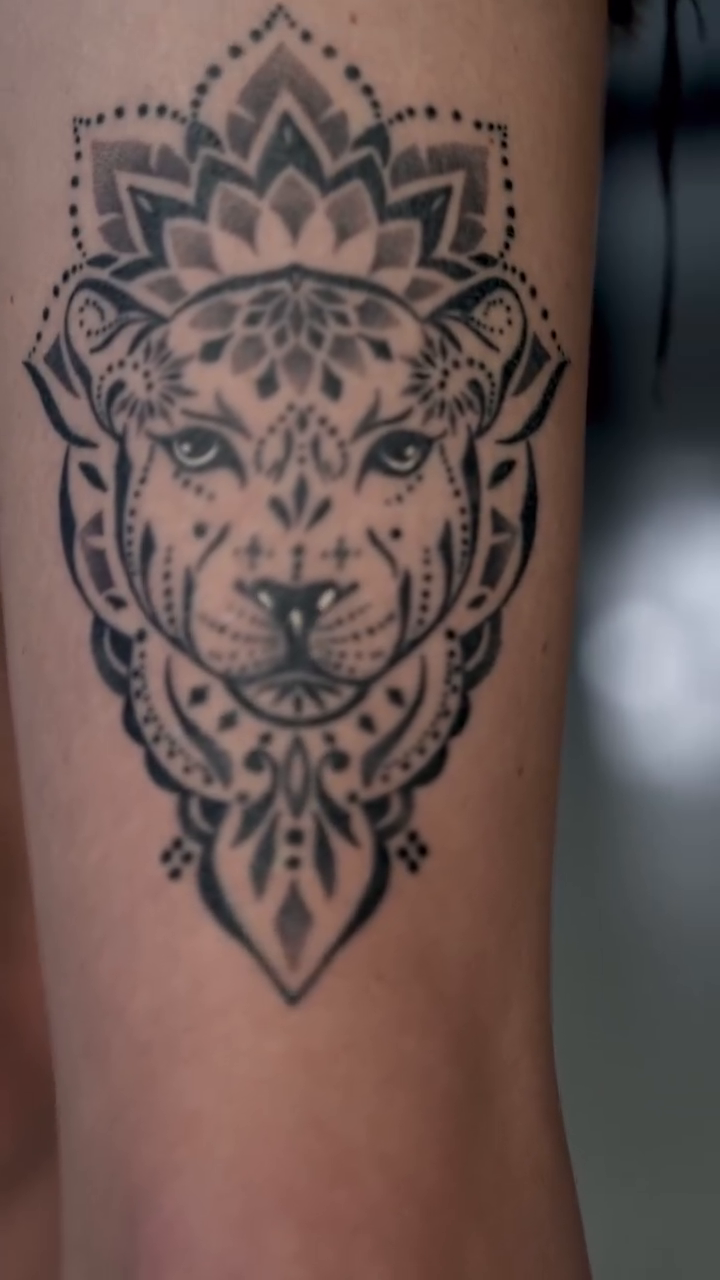 Leopard head with mandala geometric tattoo by ⓝⓐⓘⓡⓐⓓⓞⓣⓢ