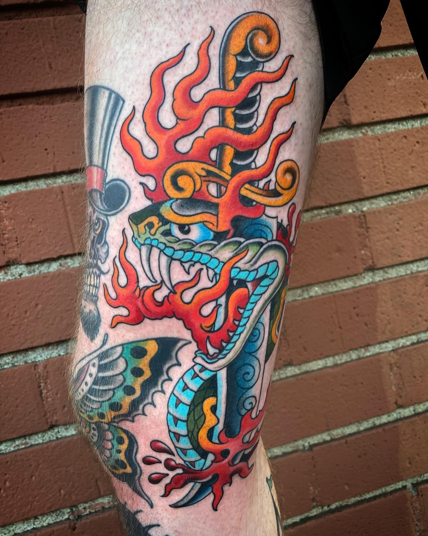 Flame dragon American traditional tattoo on the forearm by Adam Warmerdam, Los Angeles, California