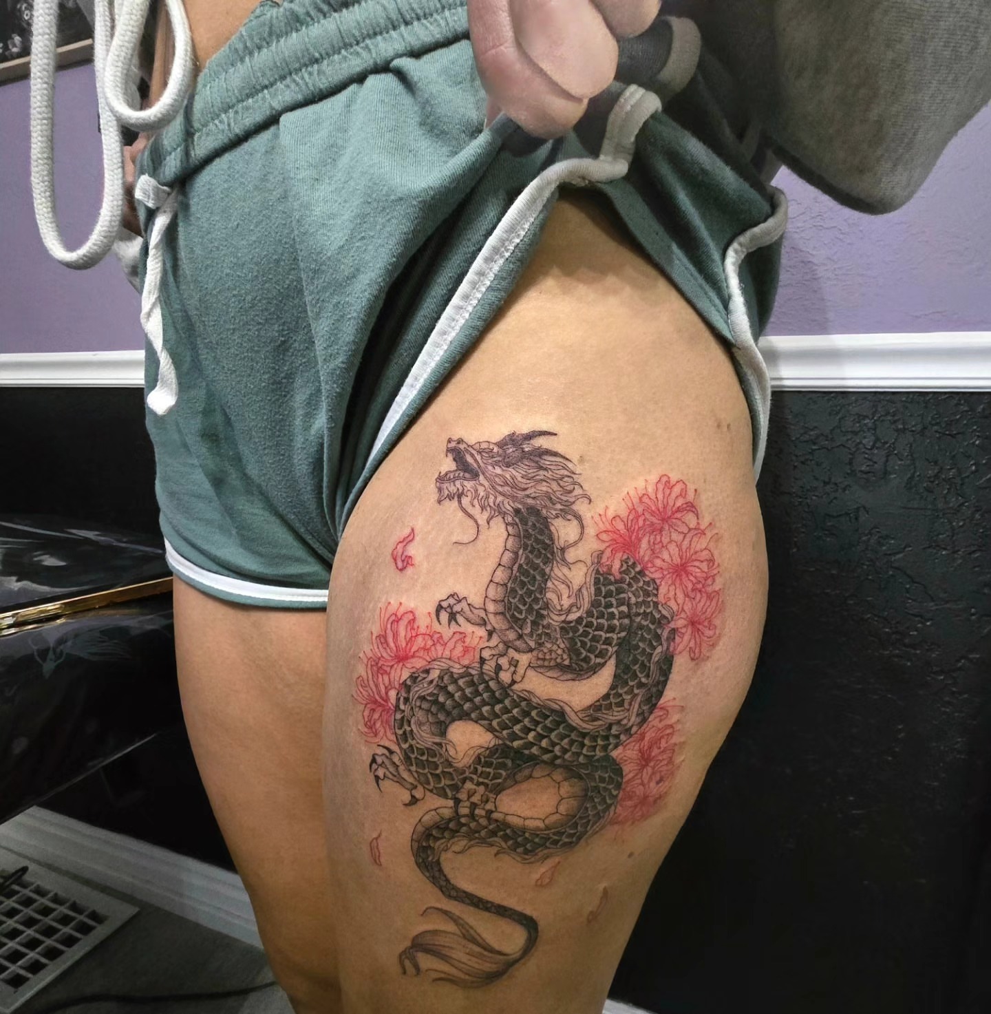 Dragon and flowers japanese irezumi tattoo on the thigh by Utah Tattoo Artist