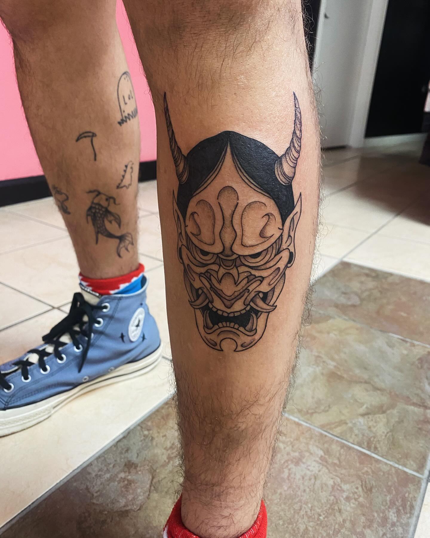 Demon mask japanese irezumi tattoo on the leg by Drew
