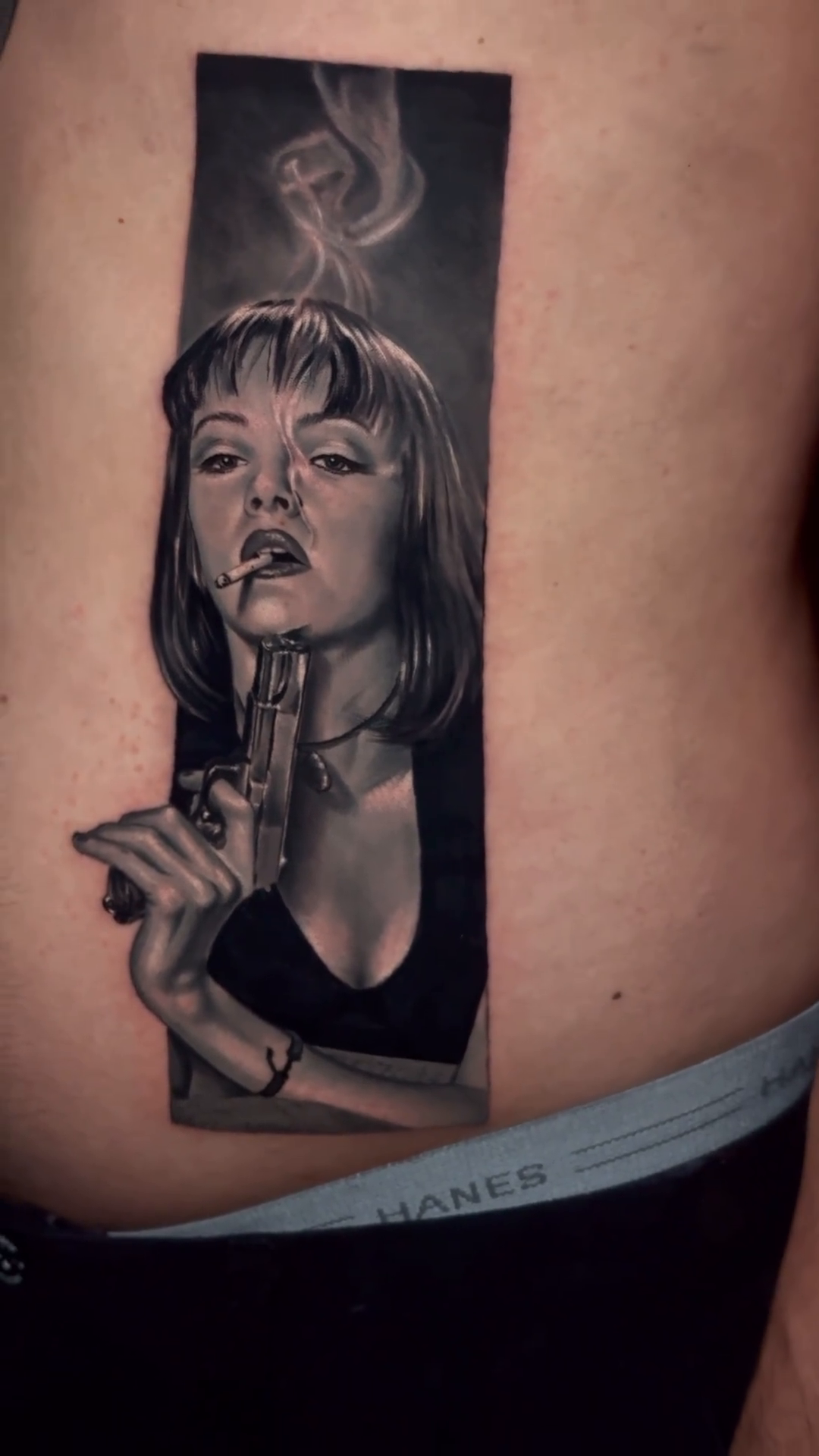 Woman with gun realism tattoo by Guillermo Columbie, Houston, Texas