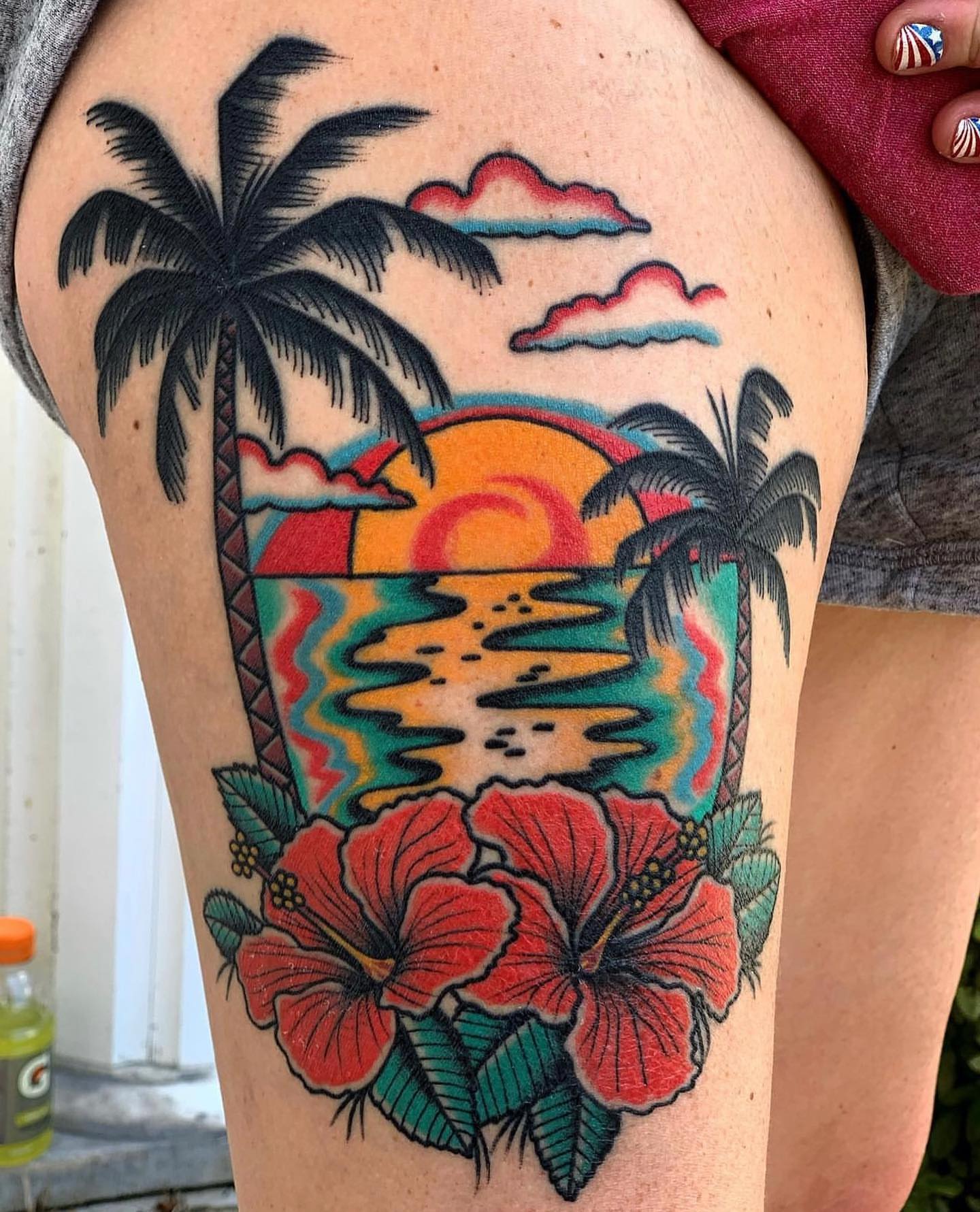 Sunset with hibiscus flowers American traditional tattoo on the thigh by Jeff Miller philly traditional tattoo