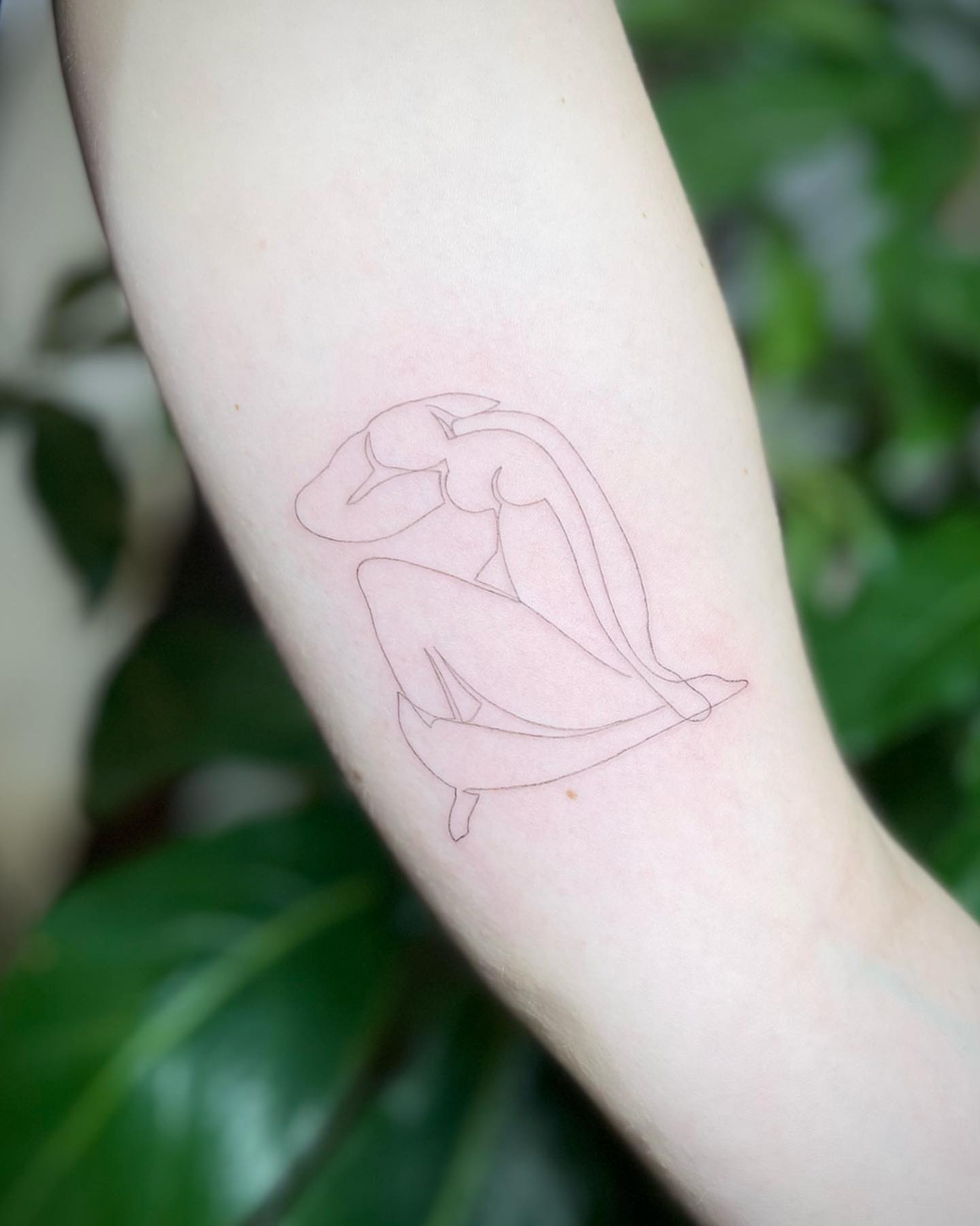 Abstract figure fine line tattoo on the forearm by Jennifer Fuster