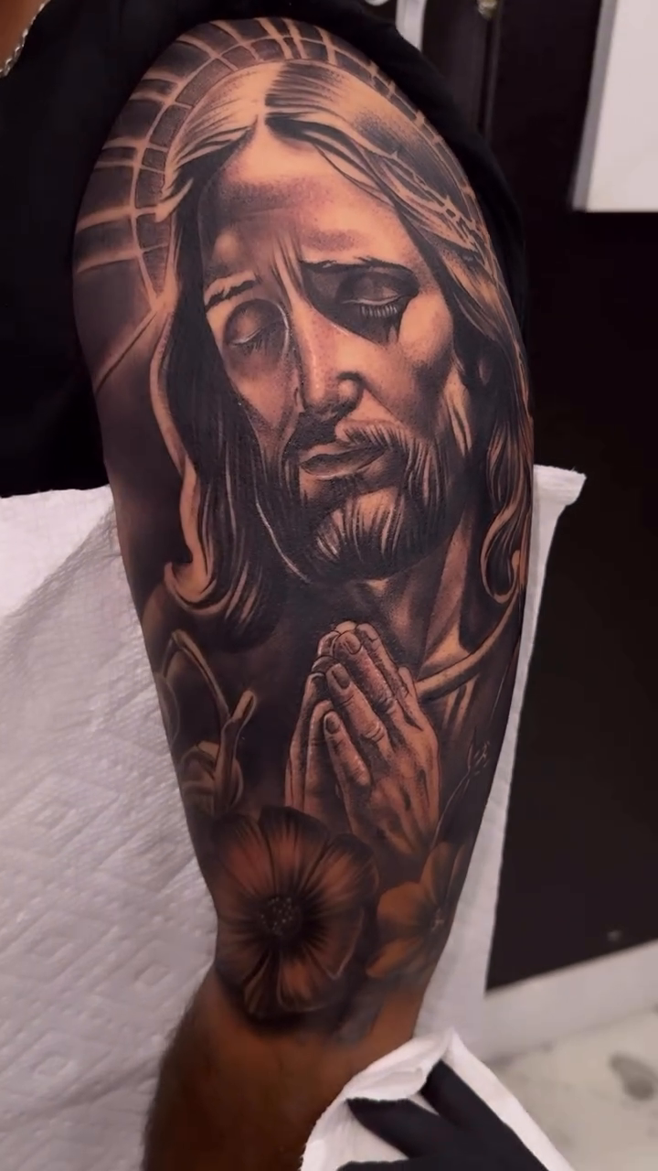 Jesus christ and praying hands realism tattoo by Tattoo